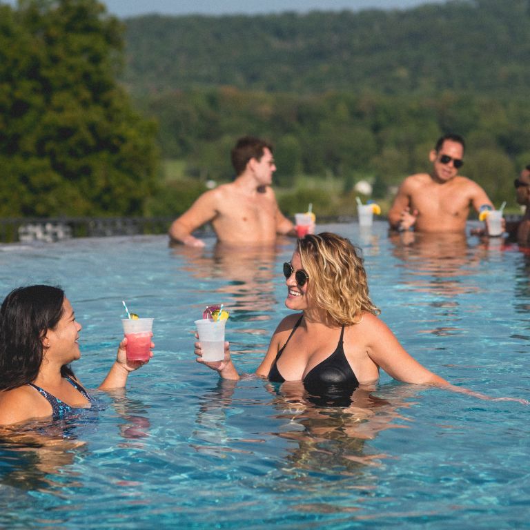 Group of friends in vista 180 pool