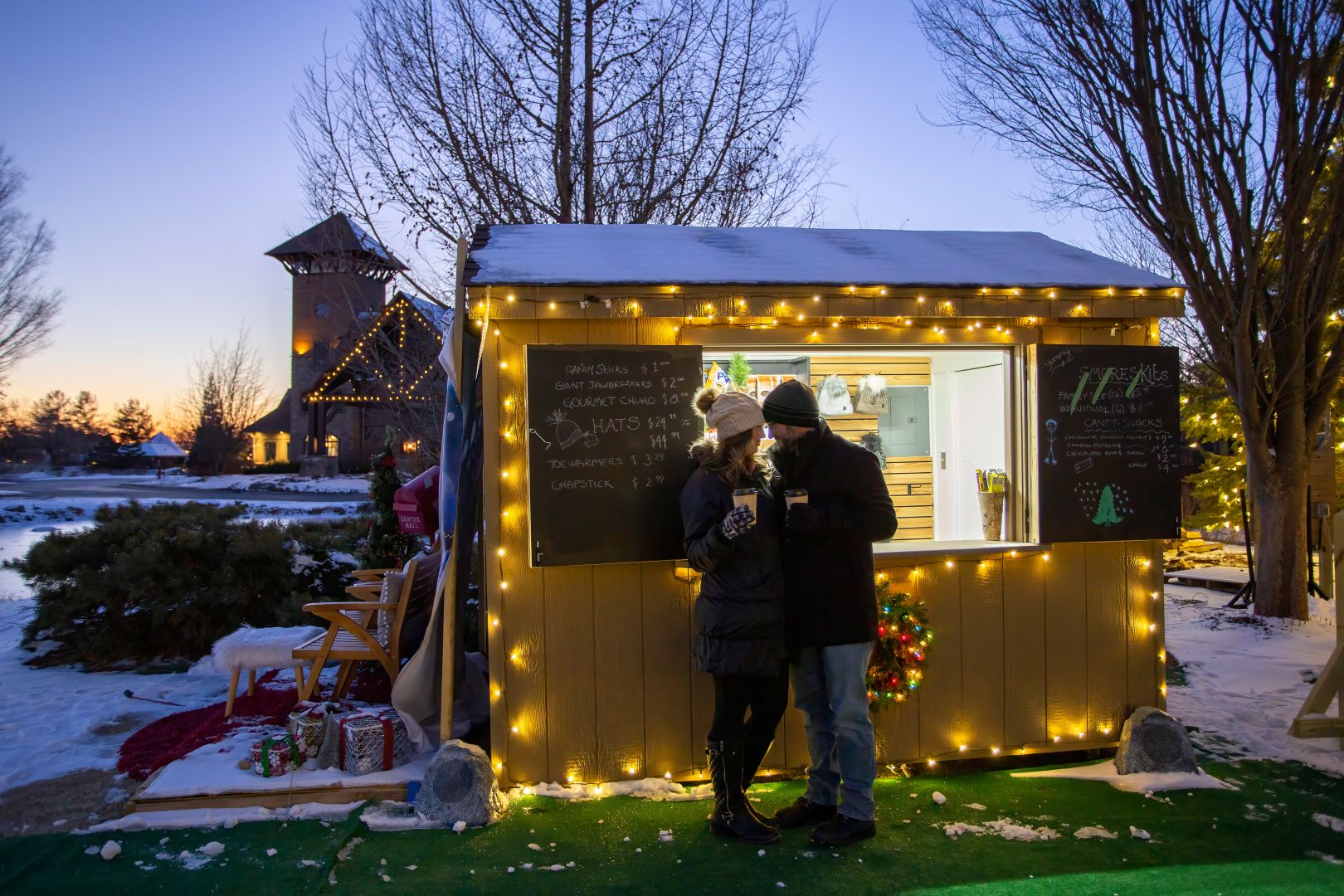 Couple standing in front of Schnapps Shack.