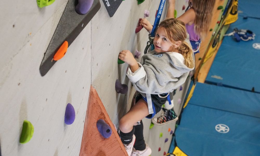 Young girl rock climbing.