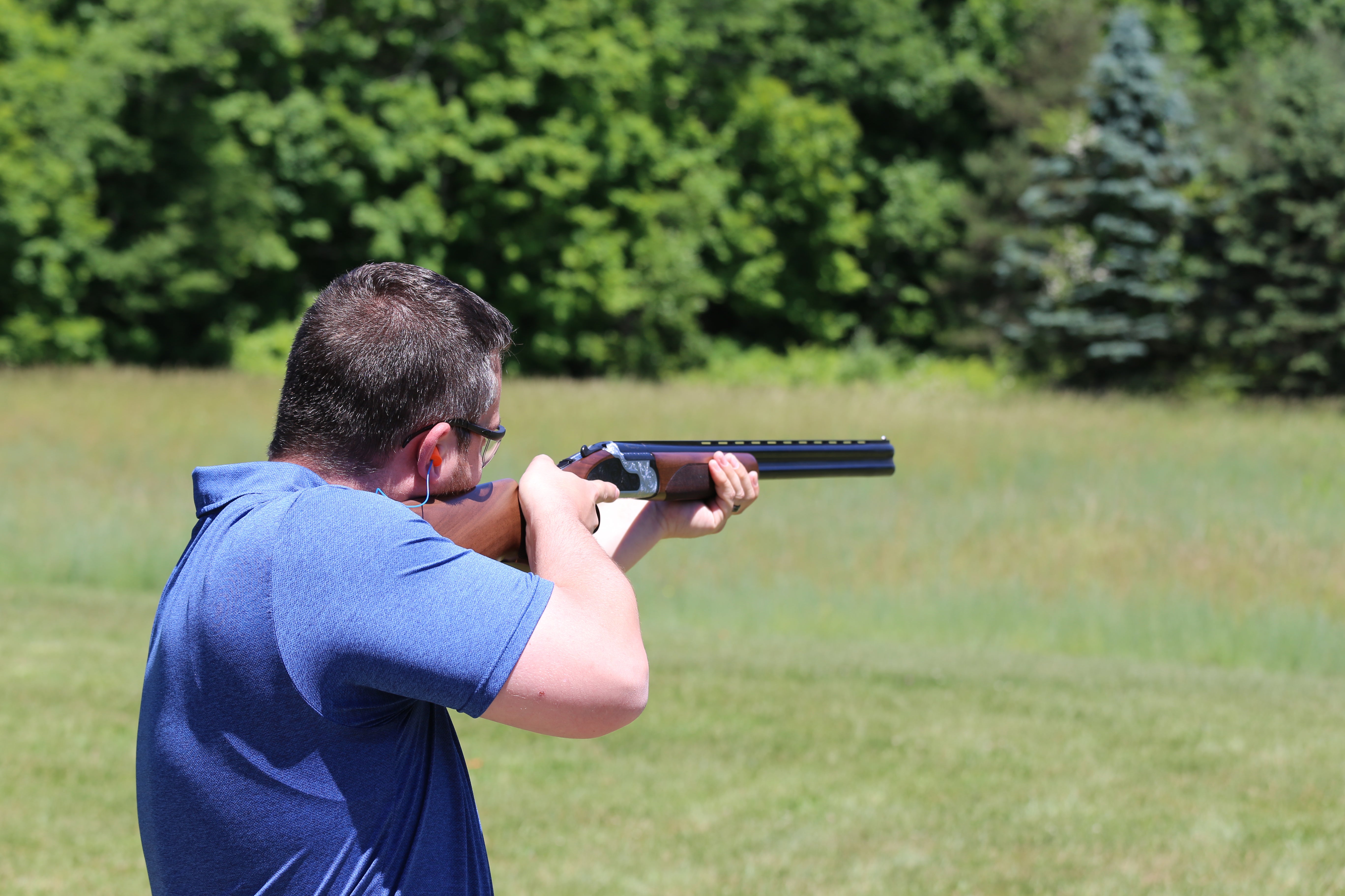 Man shooting laser clays. 