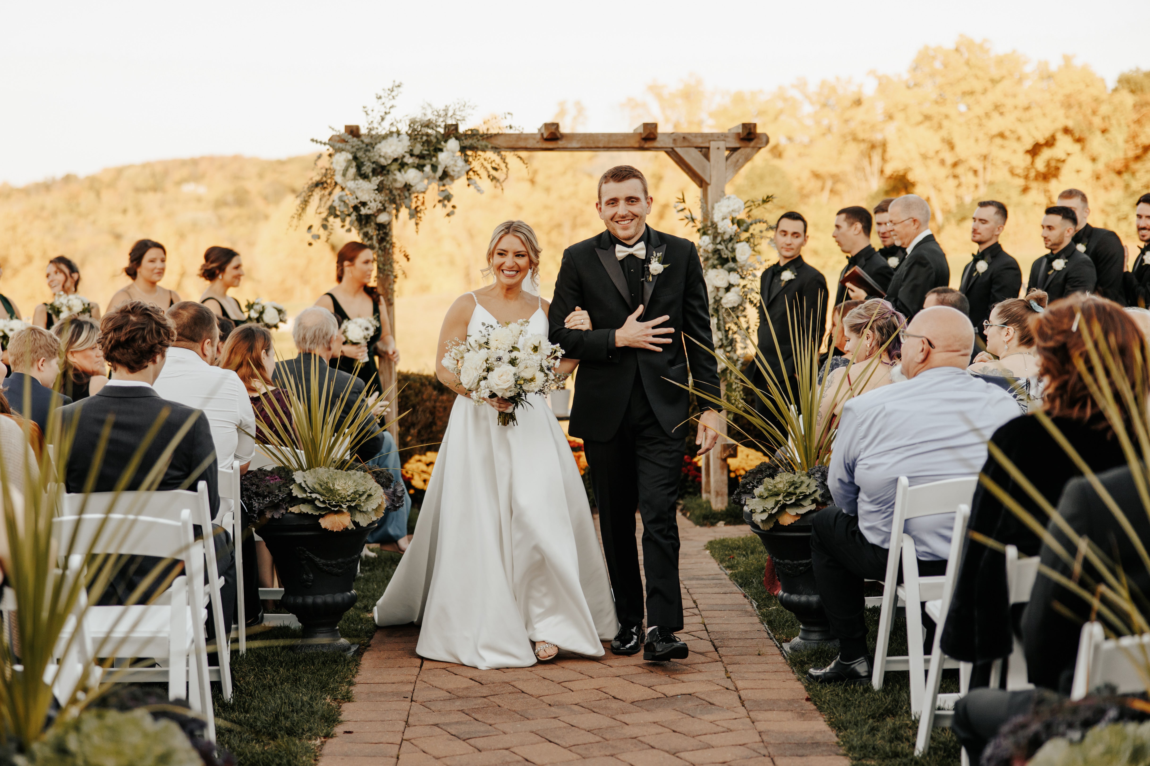 Bride and groom walk back down aisle after their Ballyowen Wedding Garden fall ceremony.
