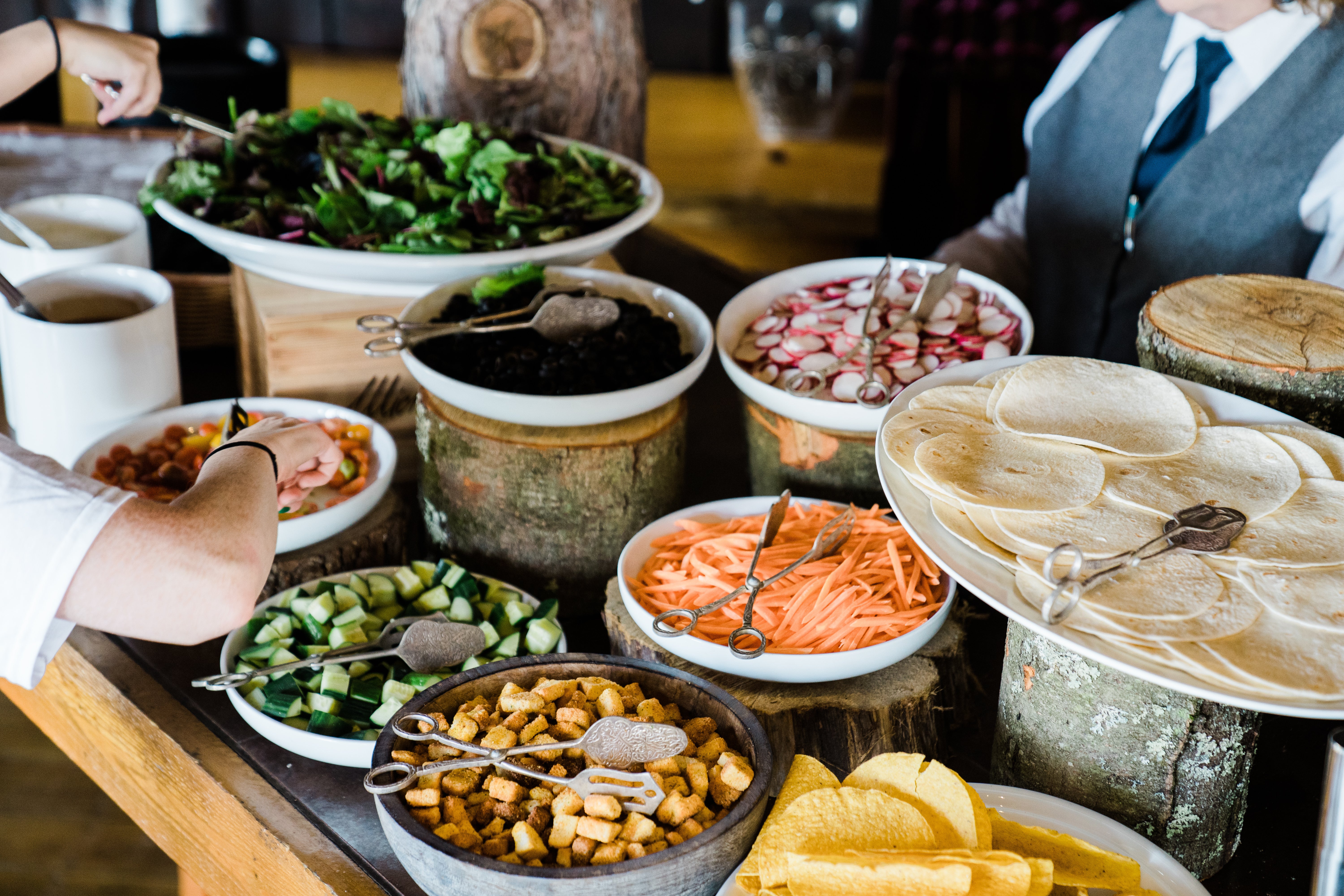 Taco station featuring an array of vegetables. 