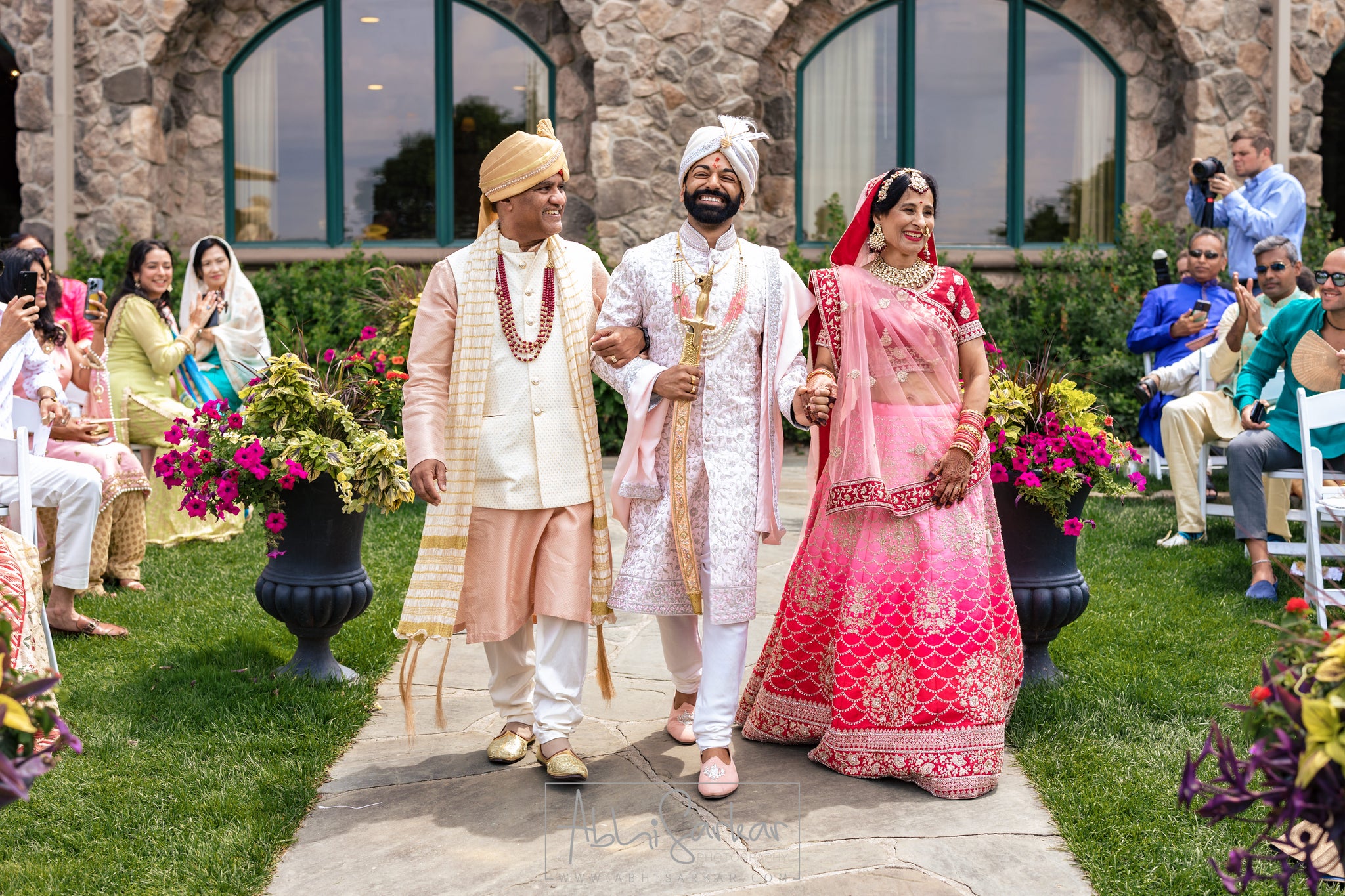 Groom walks down aisle at Bride walking down the aisle at Wedding Garden ceremony space at Crystal Springs Country Club. 