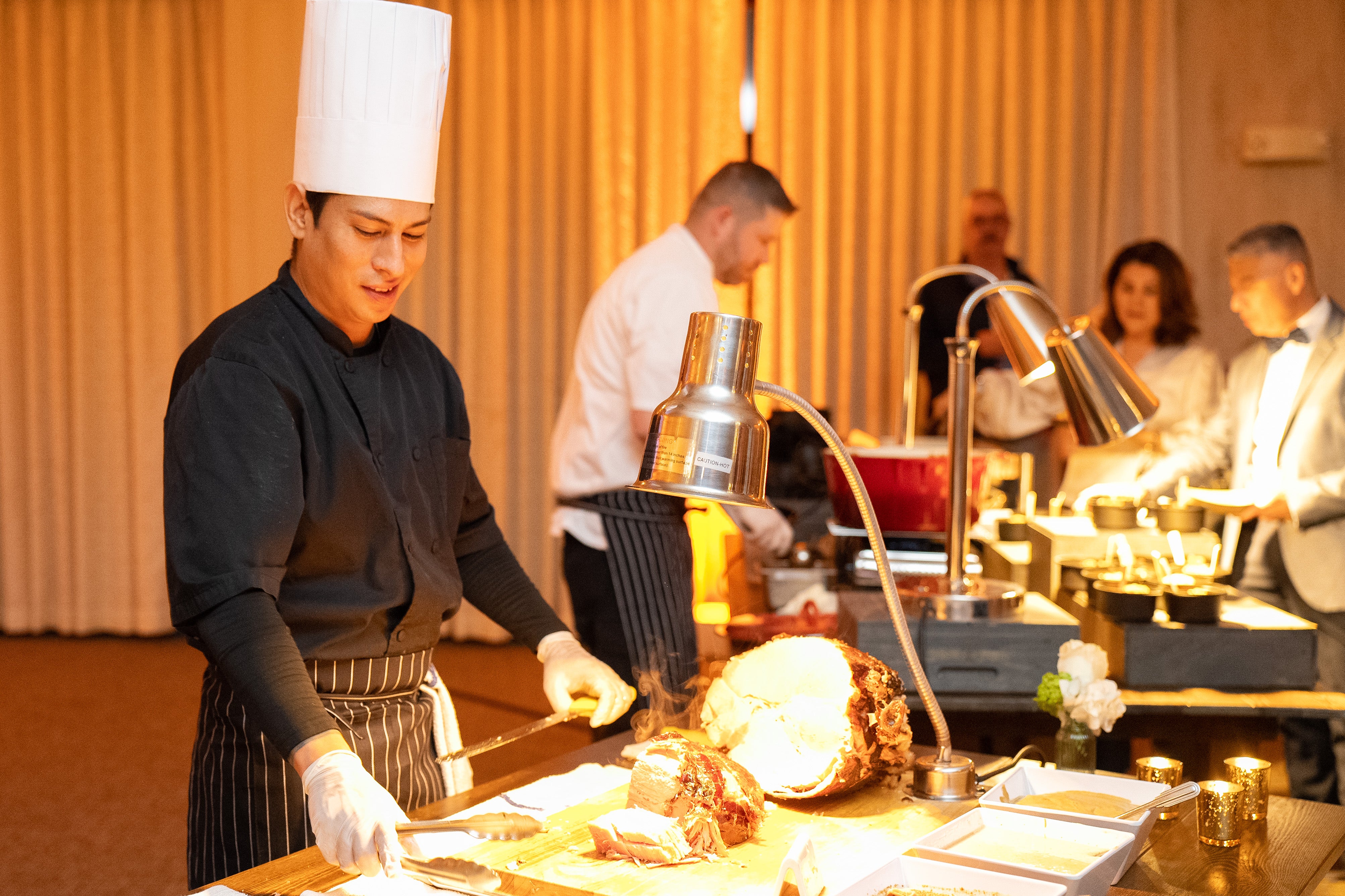 Chef's serving food in Diamond Cocktail Room. 