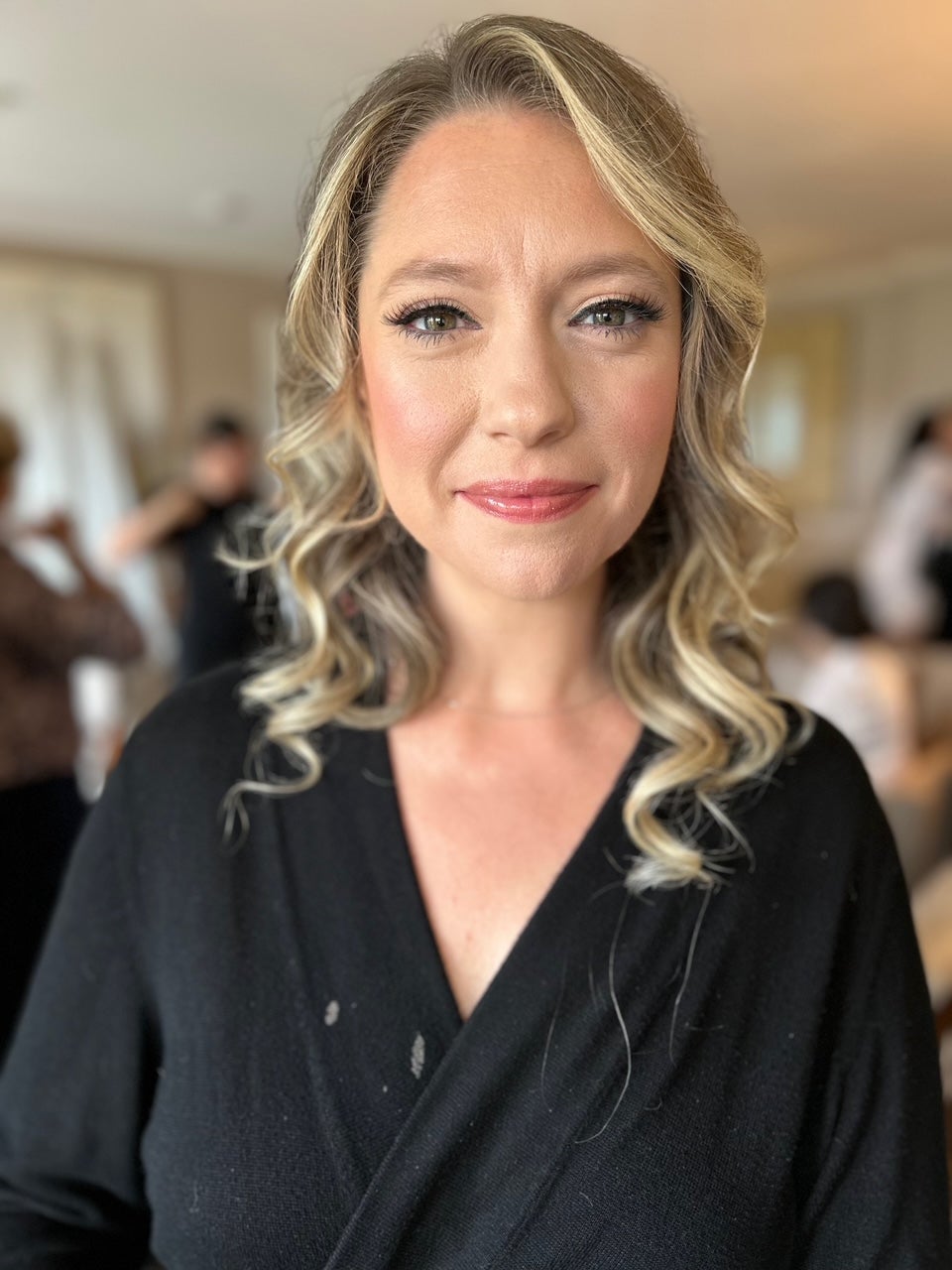 Woman with blonde curled hair. 