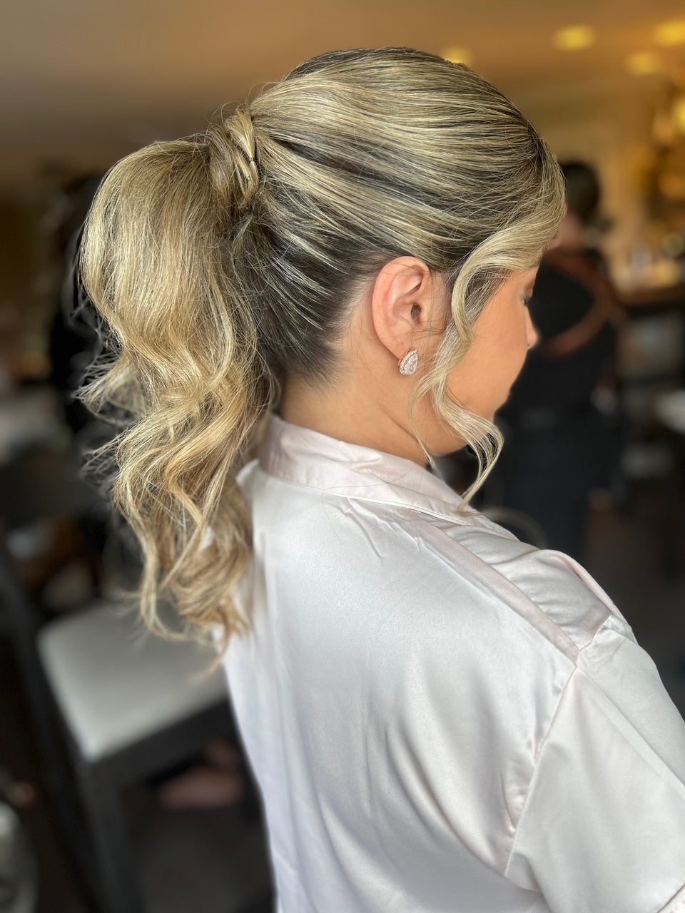 Blonde updo in a ponytail. 