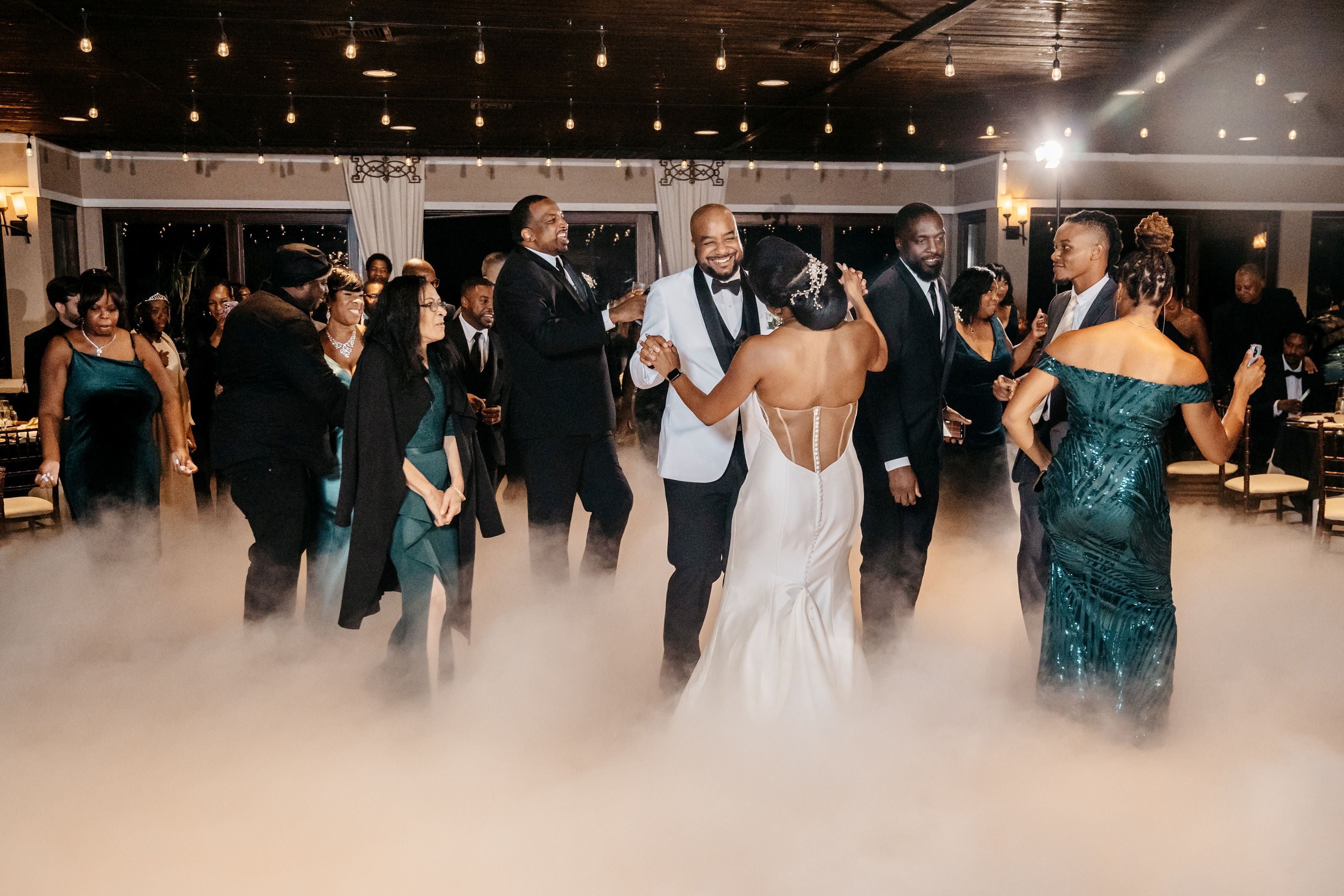 Guests dancing during reception at Bailigh Bluff House wedding reception.