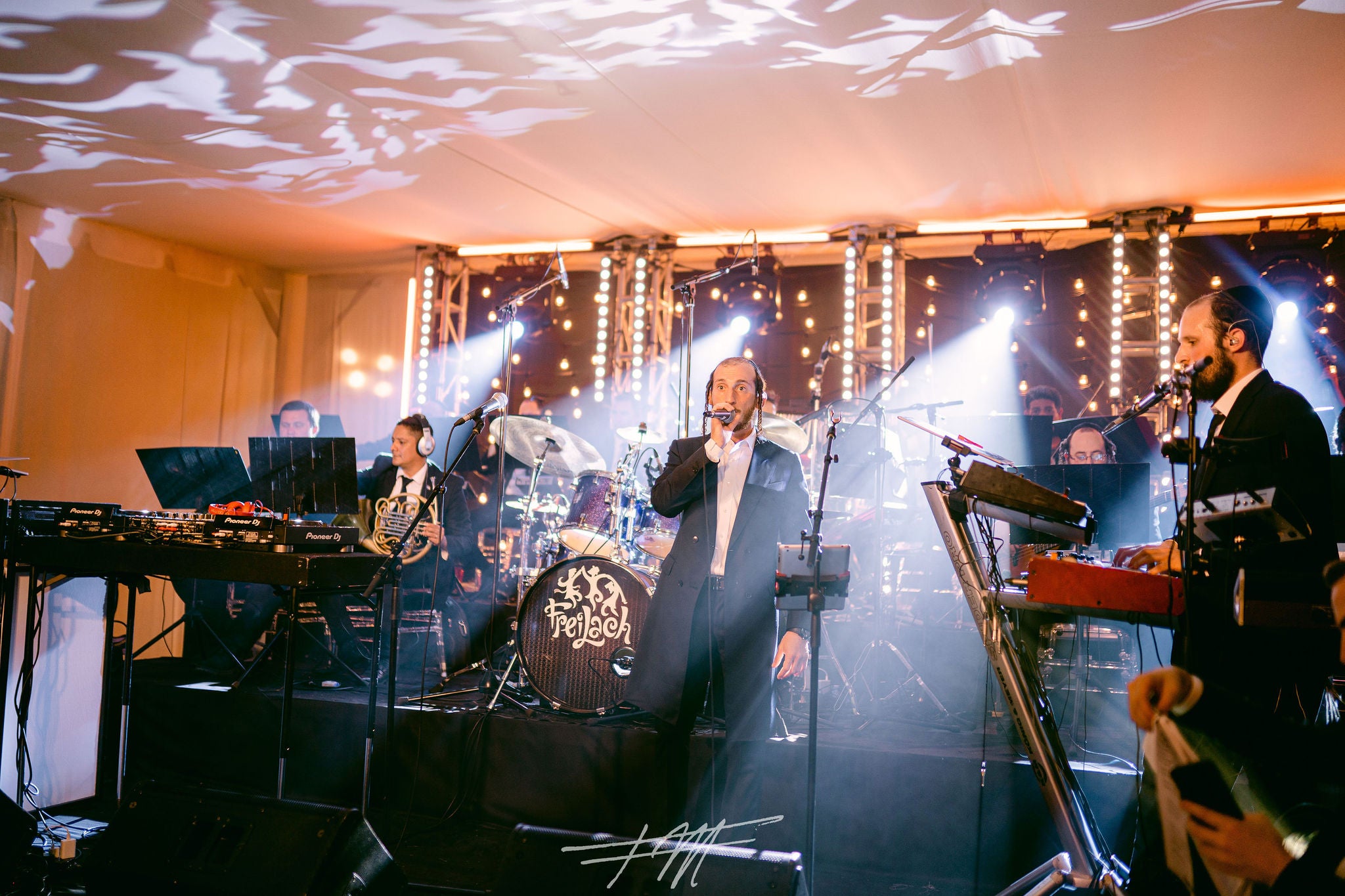 Band singing during wedding reception in Big Sky Pavillion.