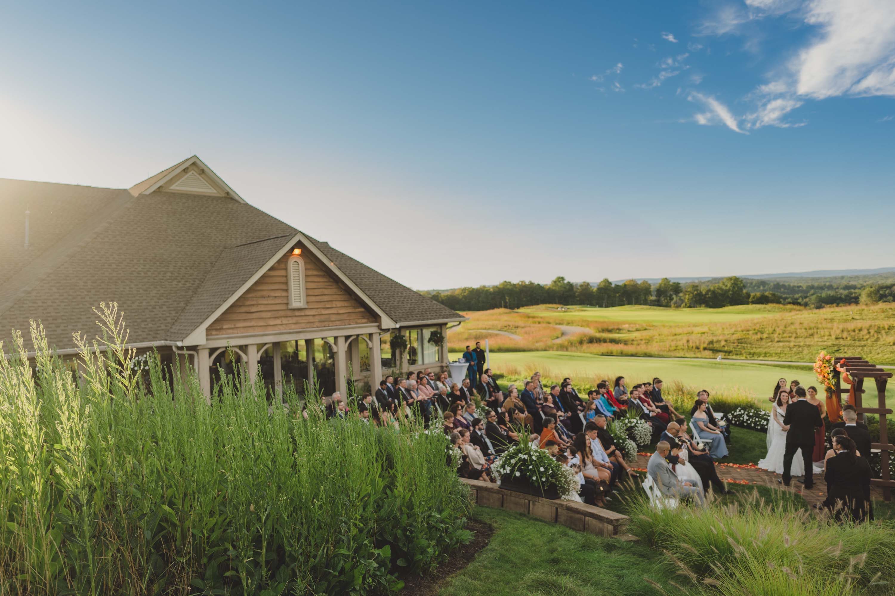 Ballyowen wedding garden ceremony with clear blue skies and mountain vistas.