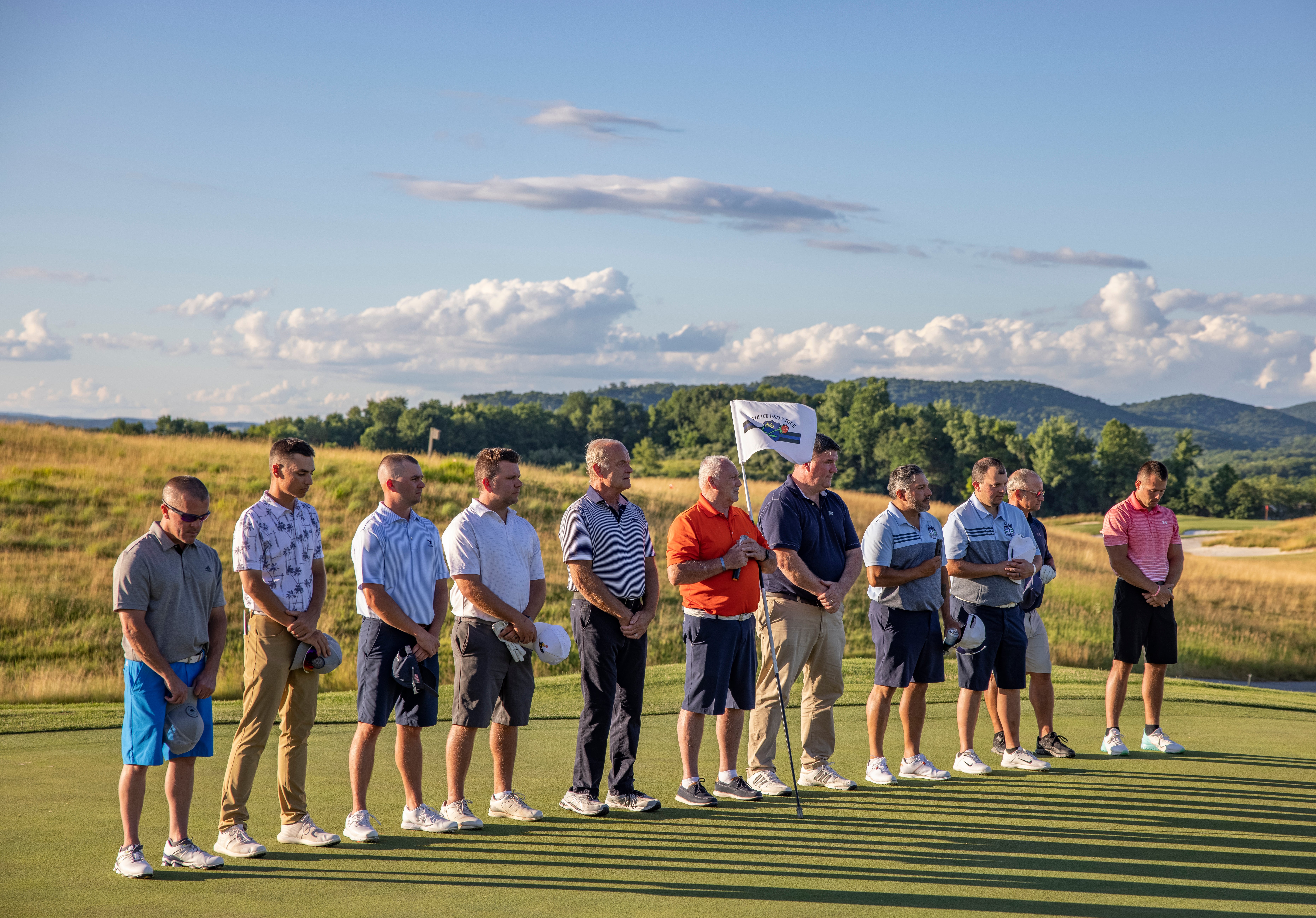 Ballyowen Law Enforcement Open golfers standing during National Anthem.