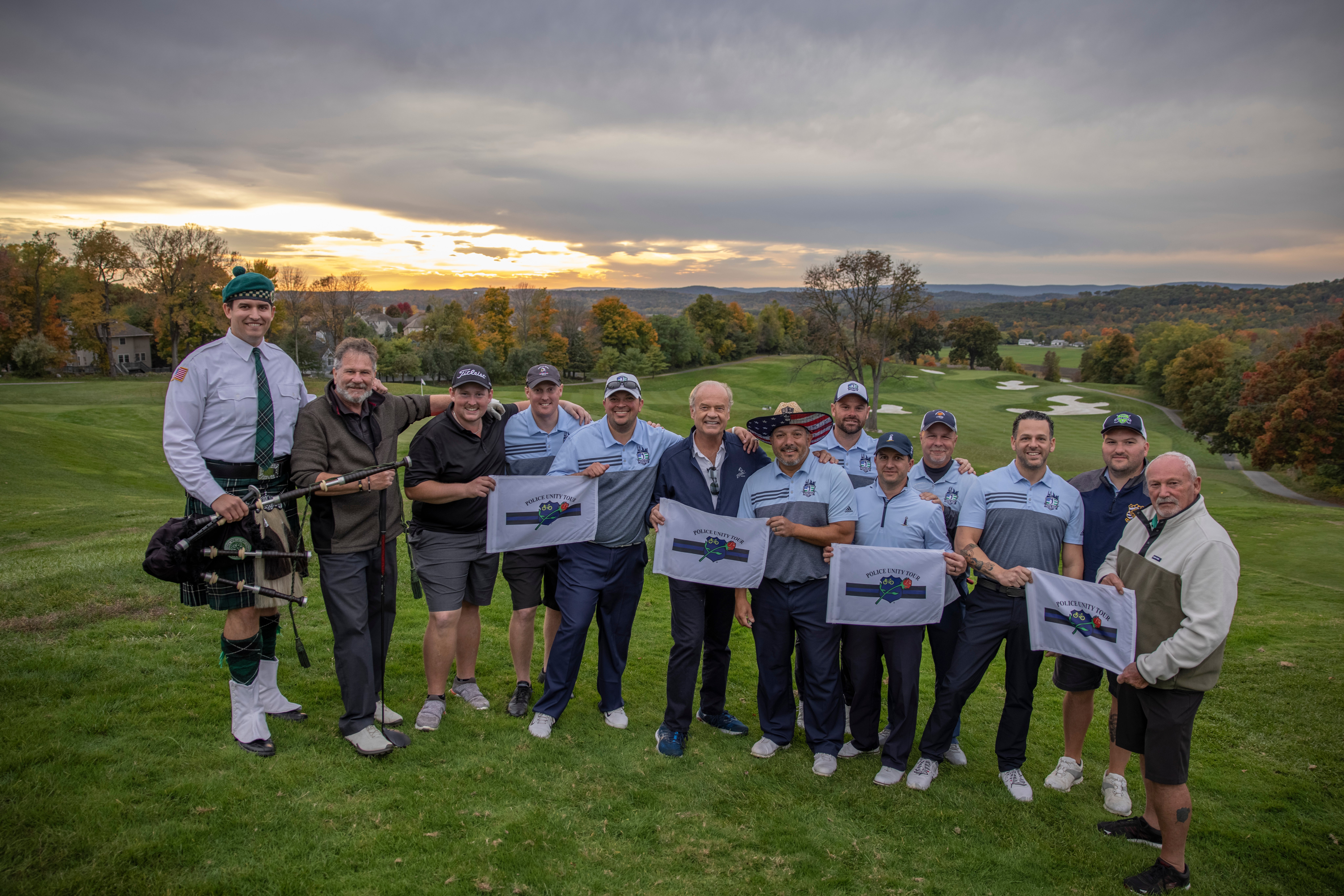 Ballyowen Law Enforcement Open golfers stand with Kelsey Grammer. 