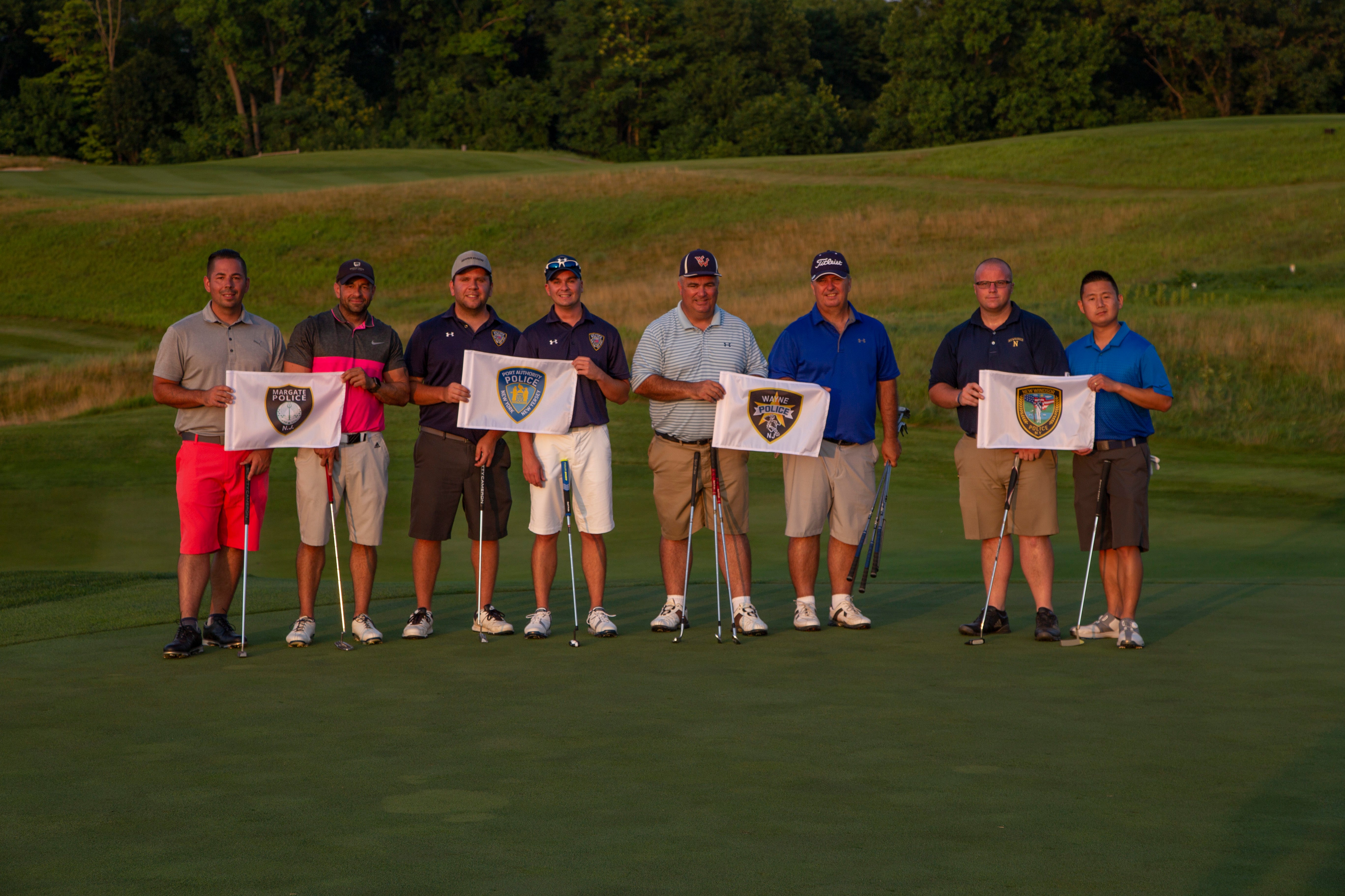 Ballyowen Law Enforcement Open golfers standing with police flags. 