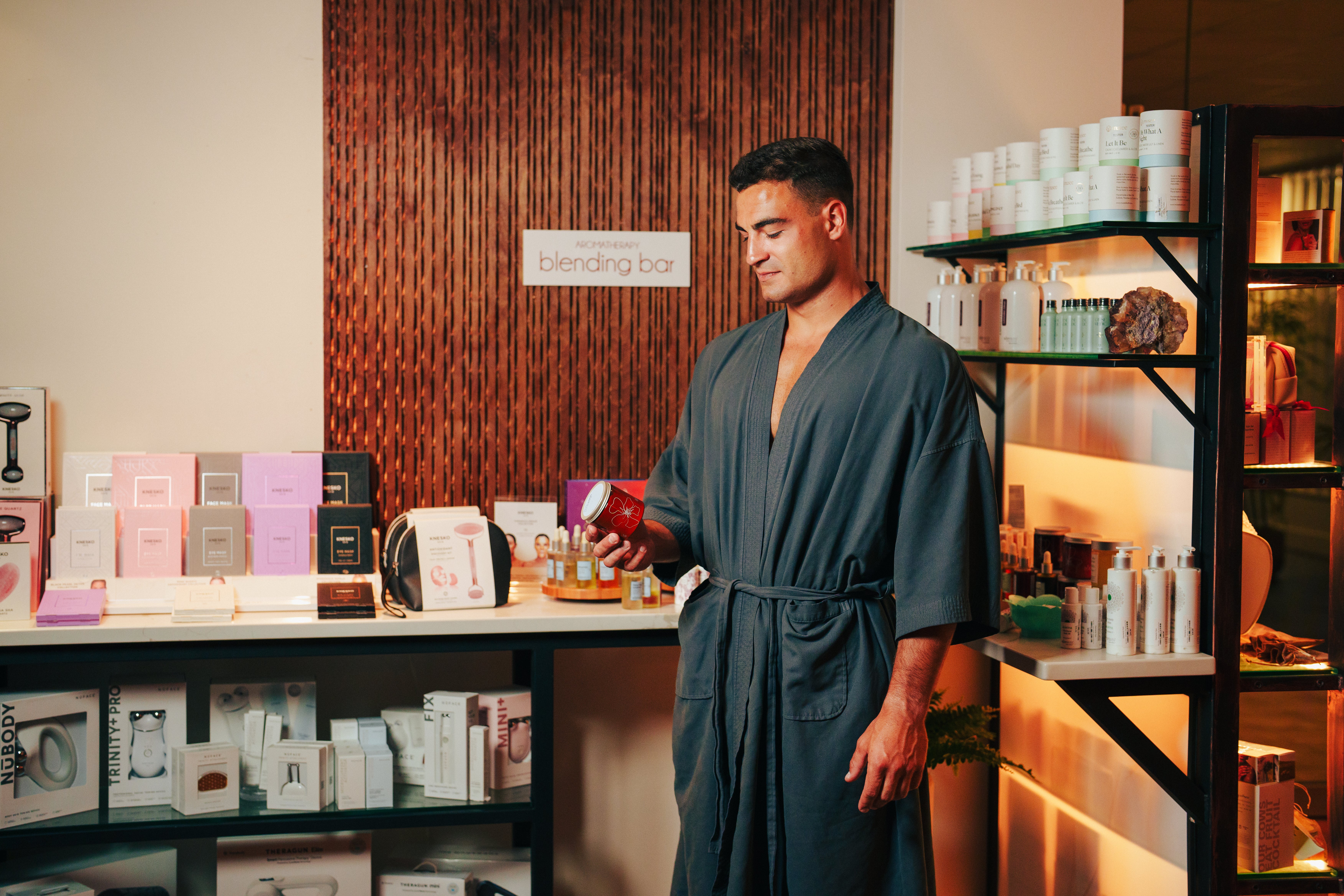 Male spa guest creates product at the Elements Spa Blending Bar