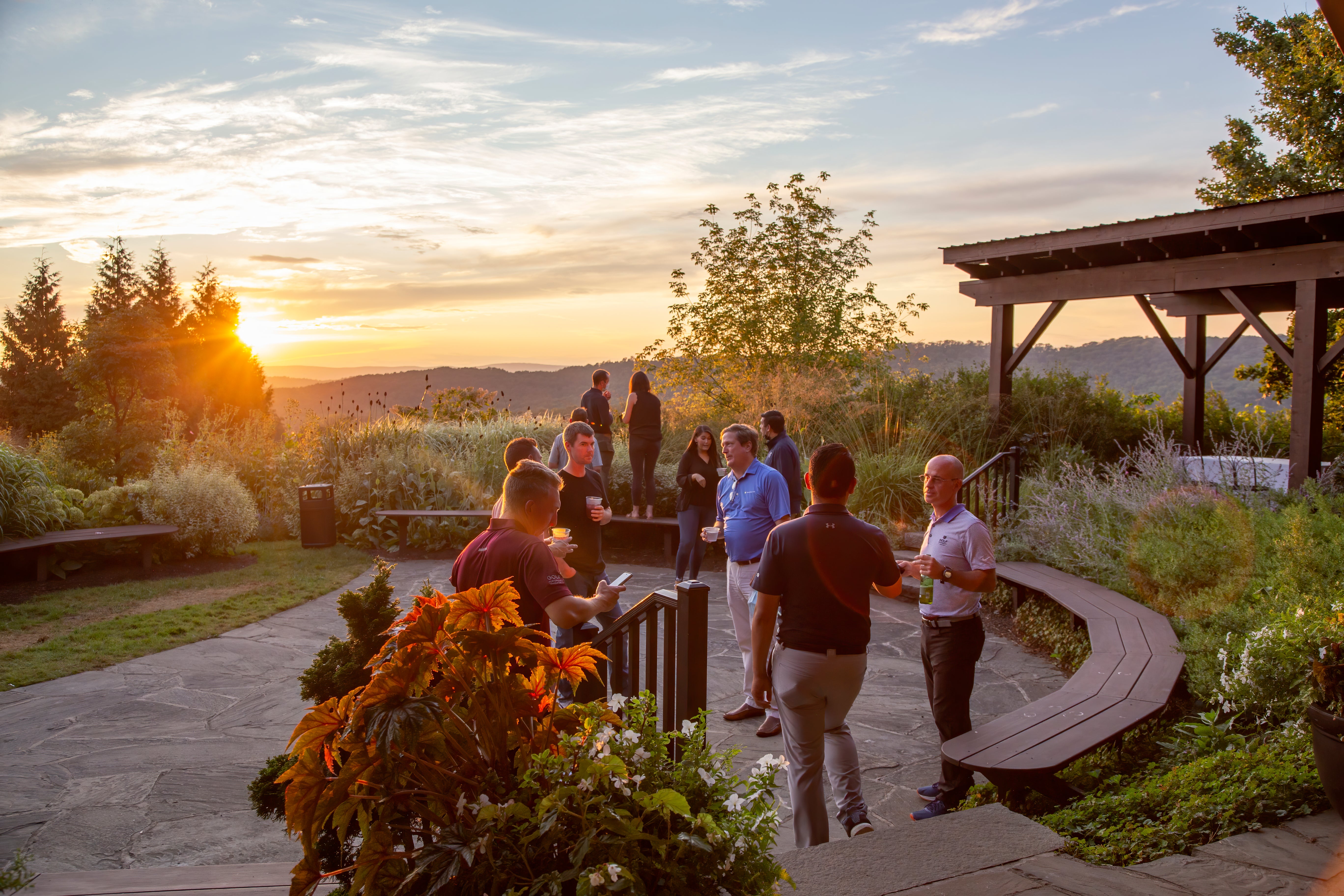 Corporate gathering in the Garden Patio during sunset. 