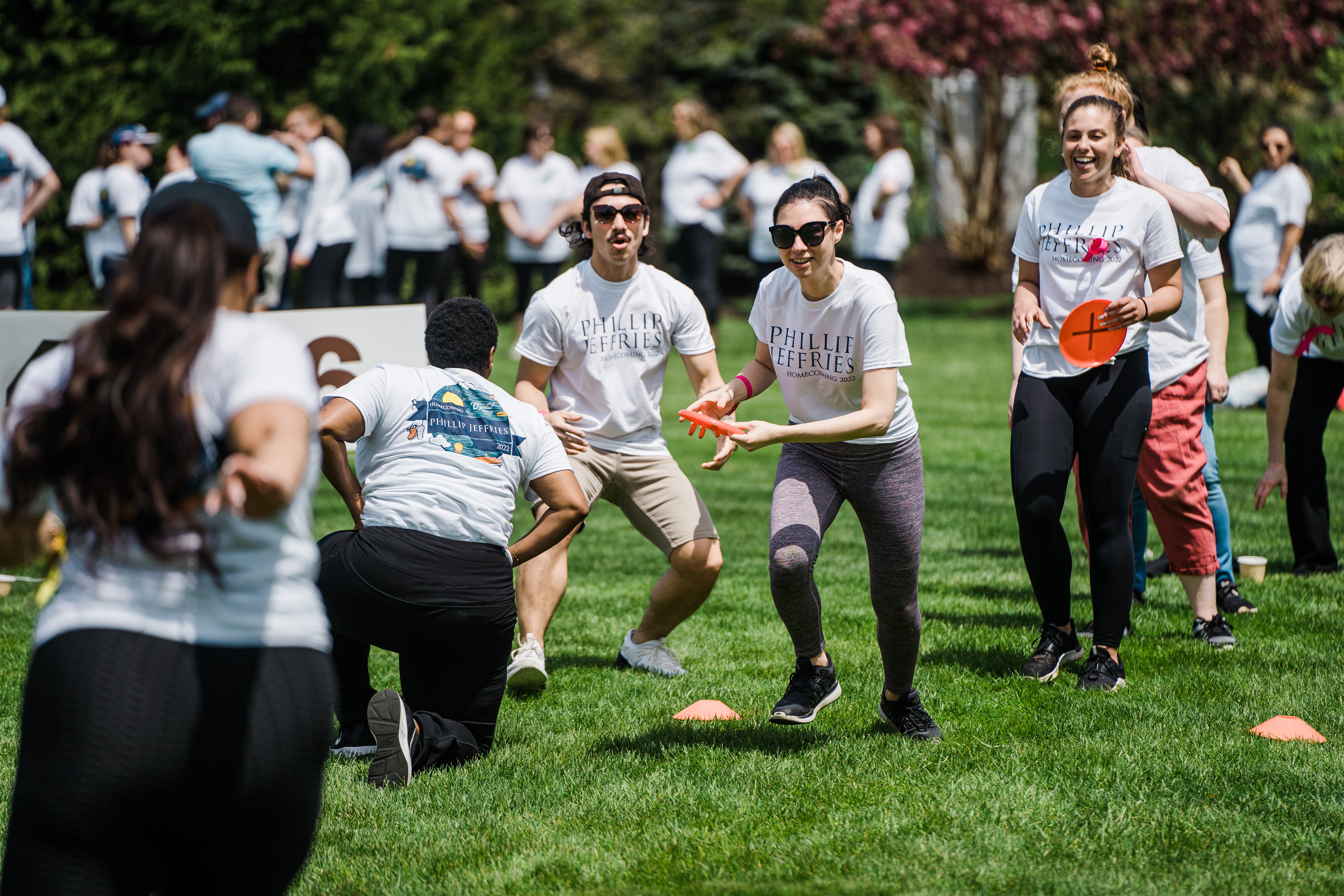 Group playing frisbee during teambuilding exercise.