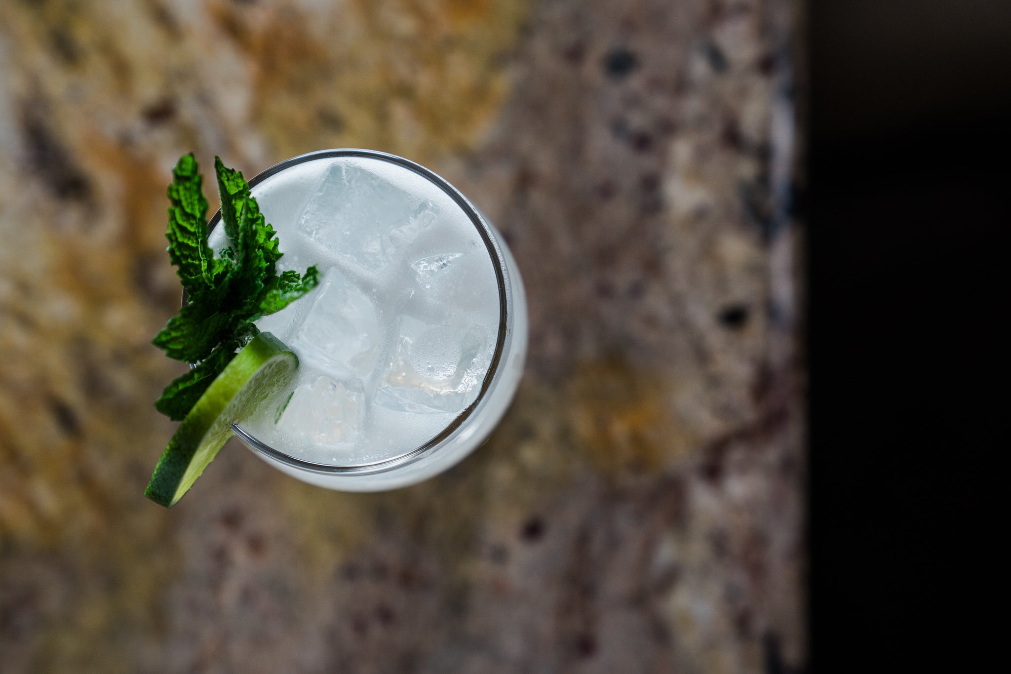 Mojito with mint on bar.  