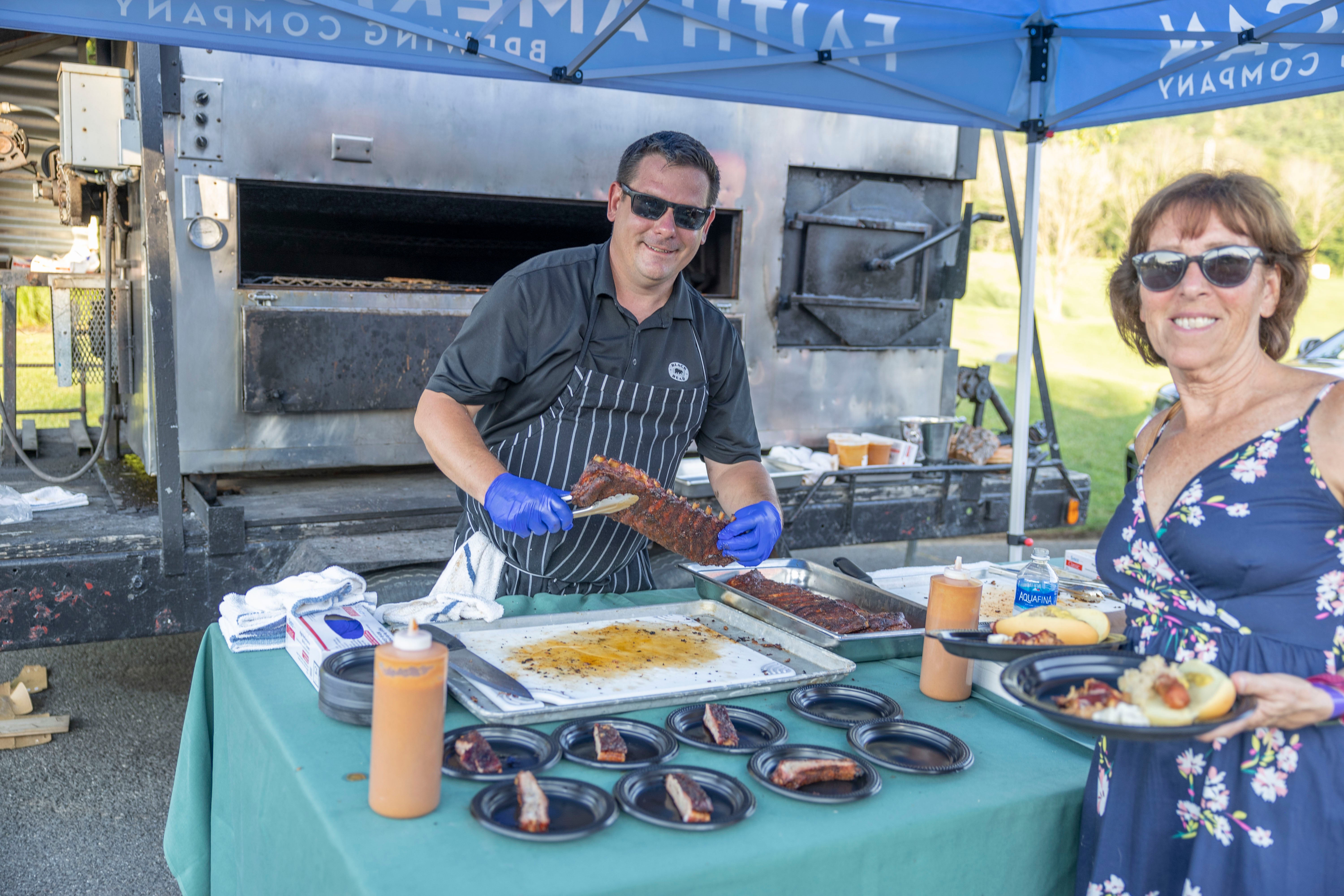 Chef cooking ribs at BBQ. 