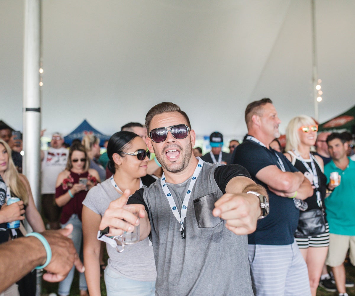 Man points at camera. 