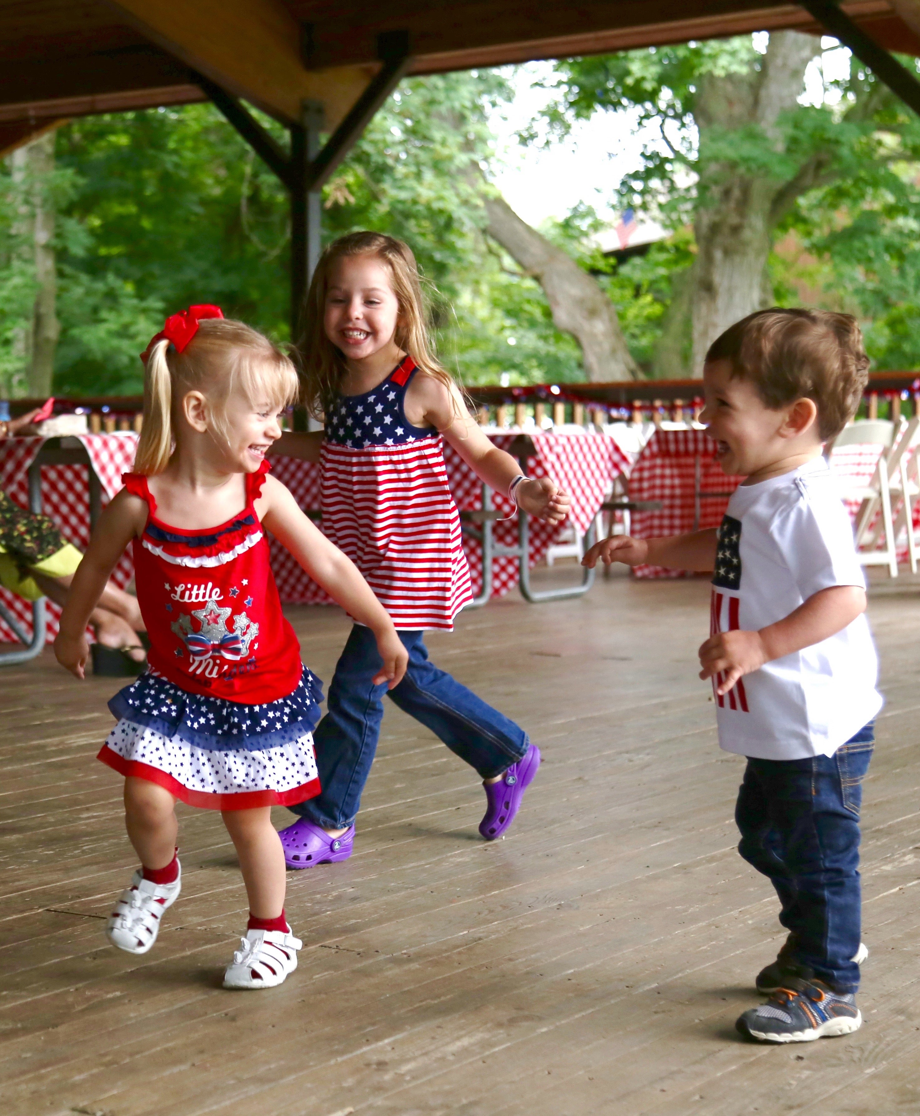 Three children dancing at 4th of July BBQ at Minerals Hotel.