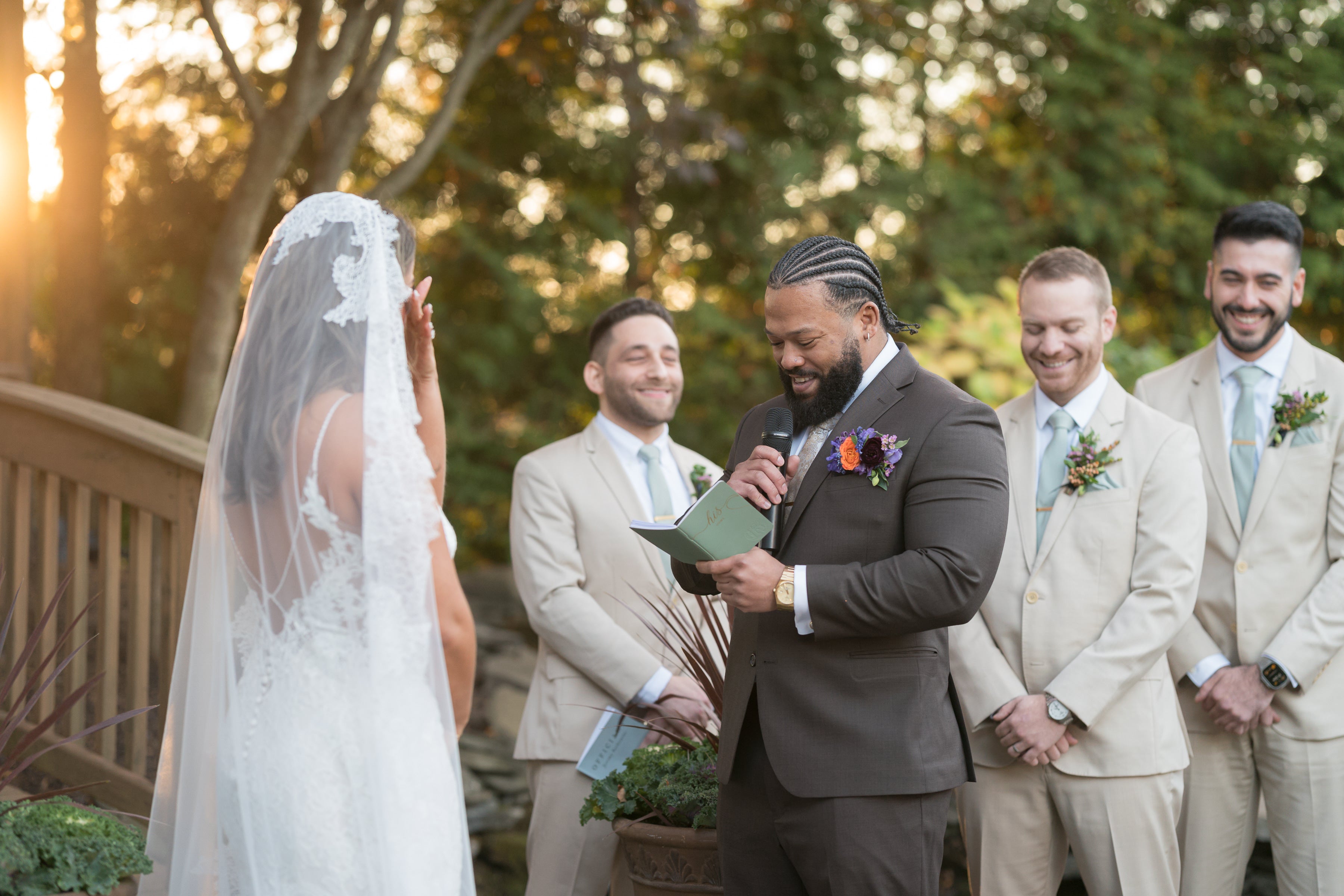 Bride and groom stand looking at each other at altar at Black Bear wedding ceremony. 