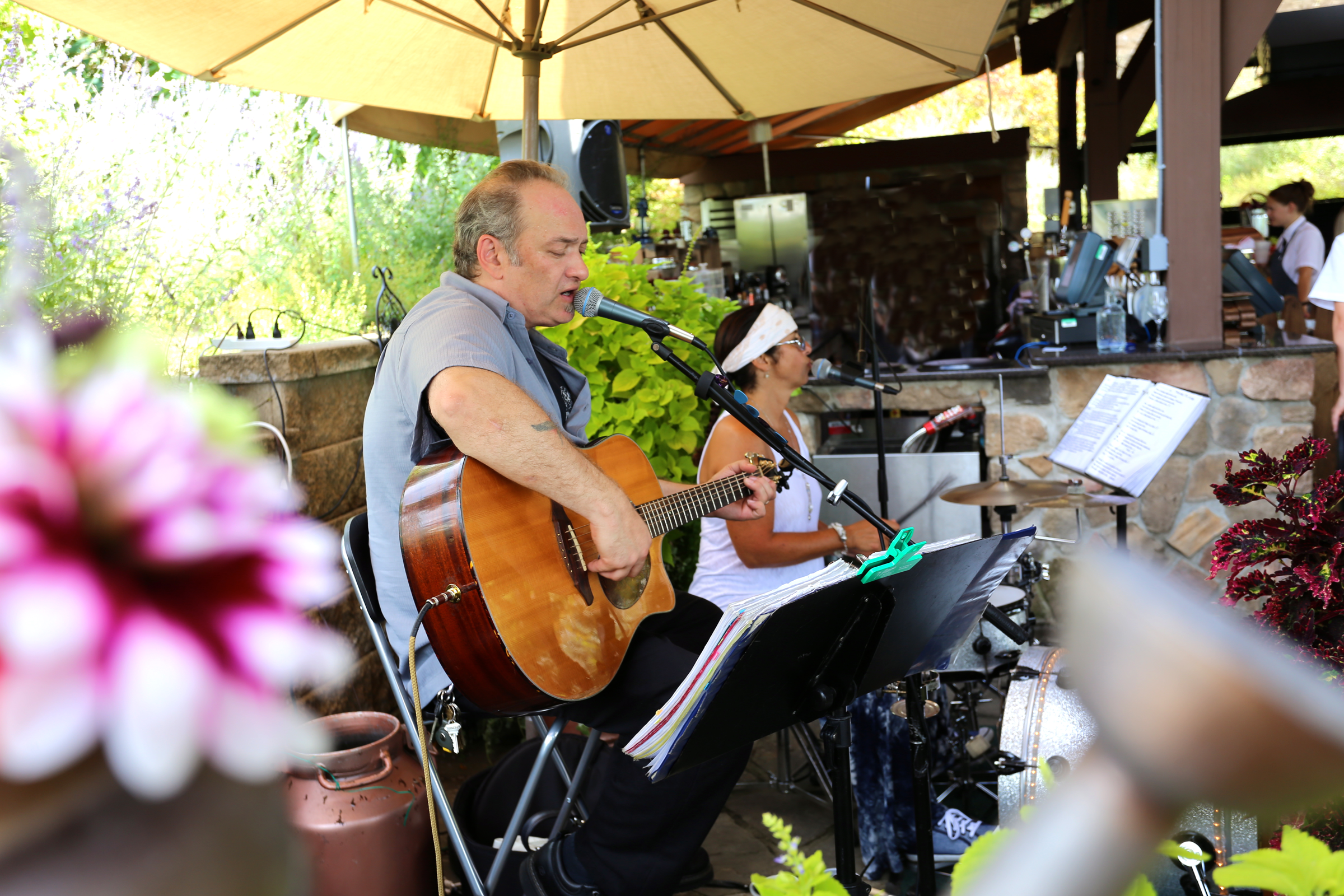 Singer and guitarist performing at BBQ.