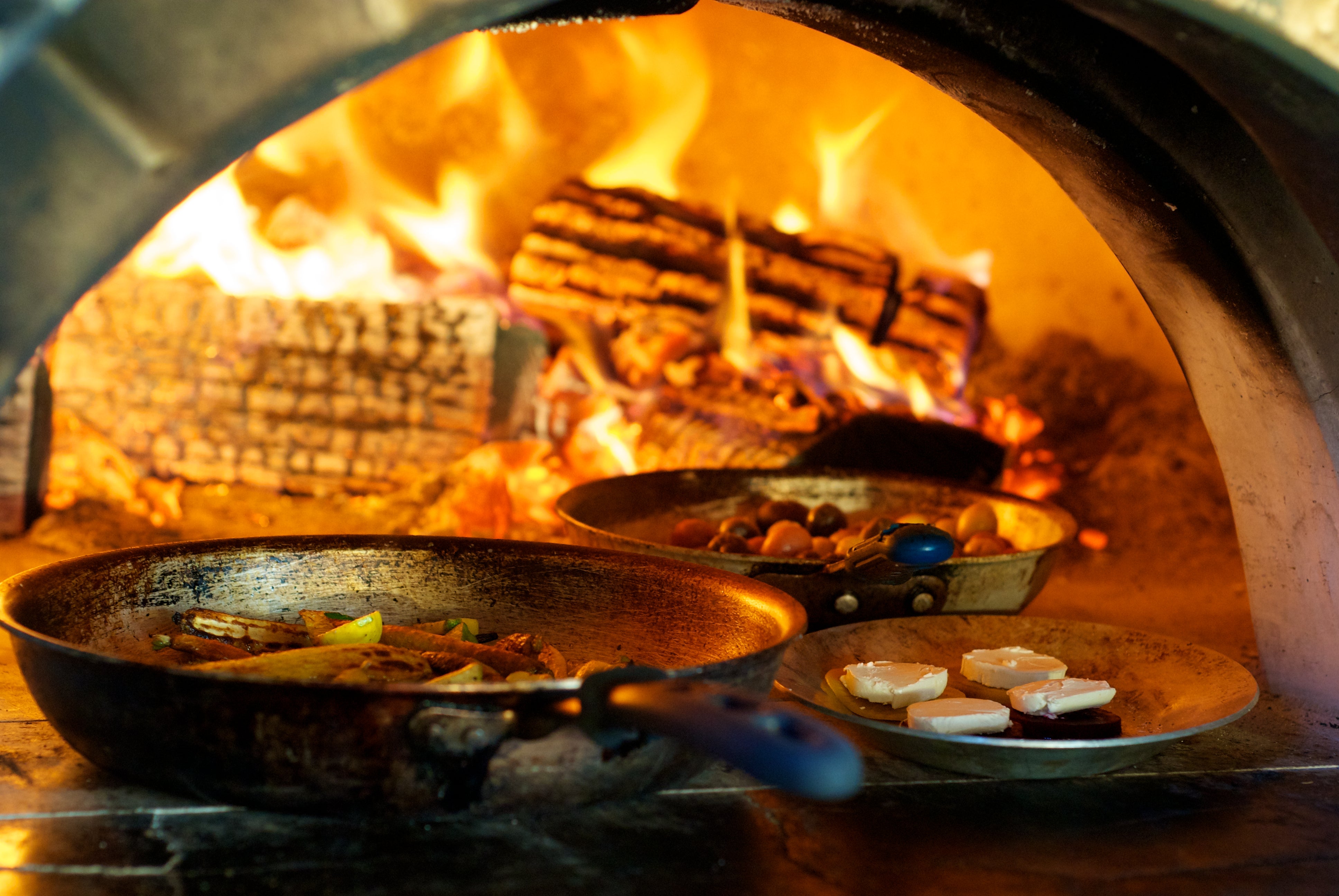 Food being prepper in wood fired stove. 