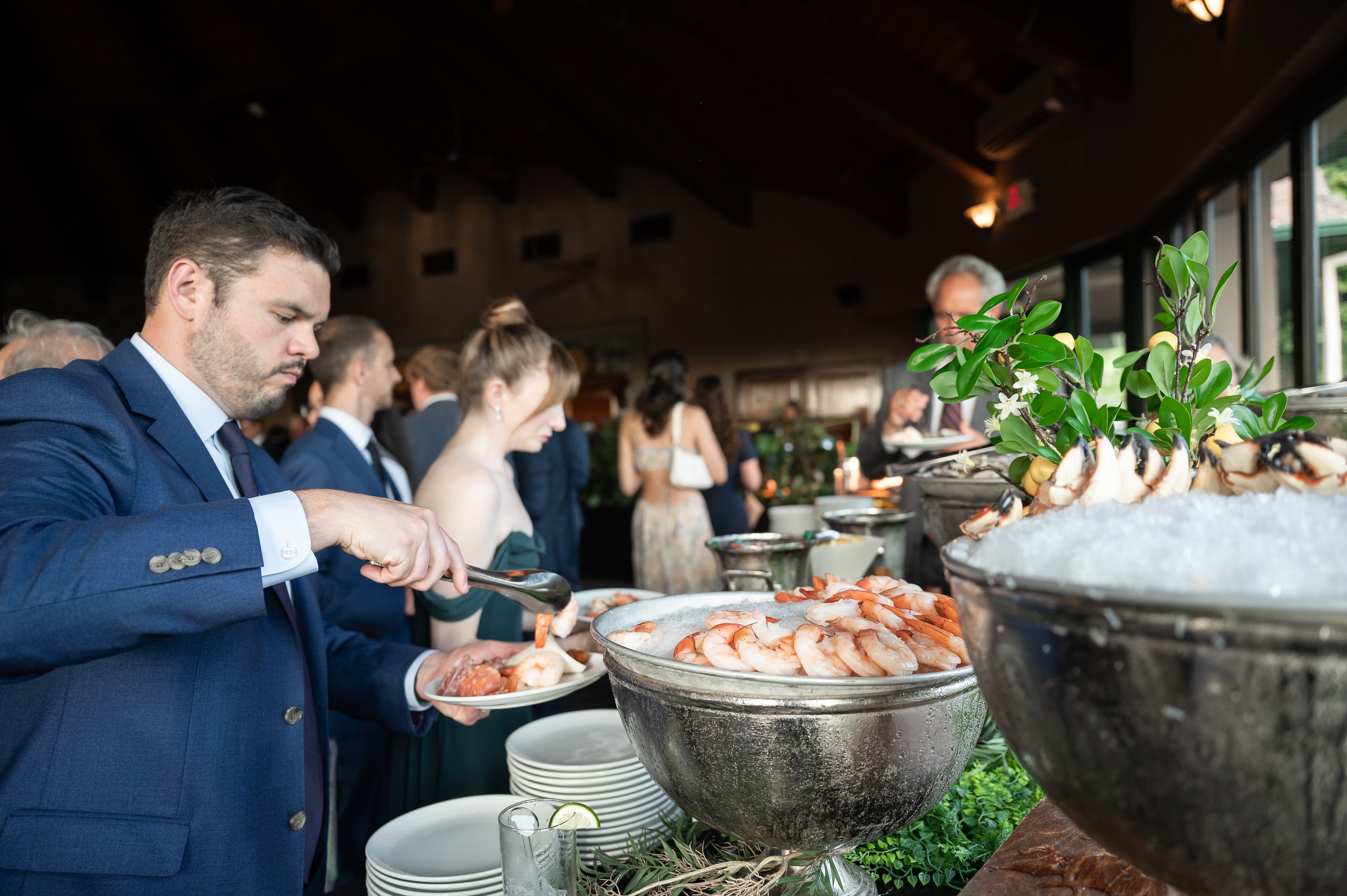 Man getting shrimp at cocktail hour in Grand Rotunda