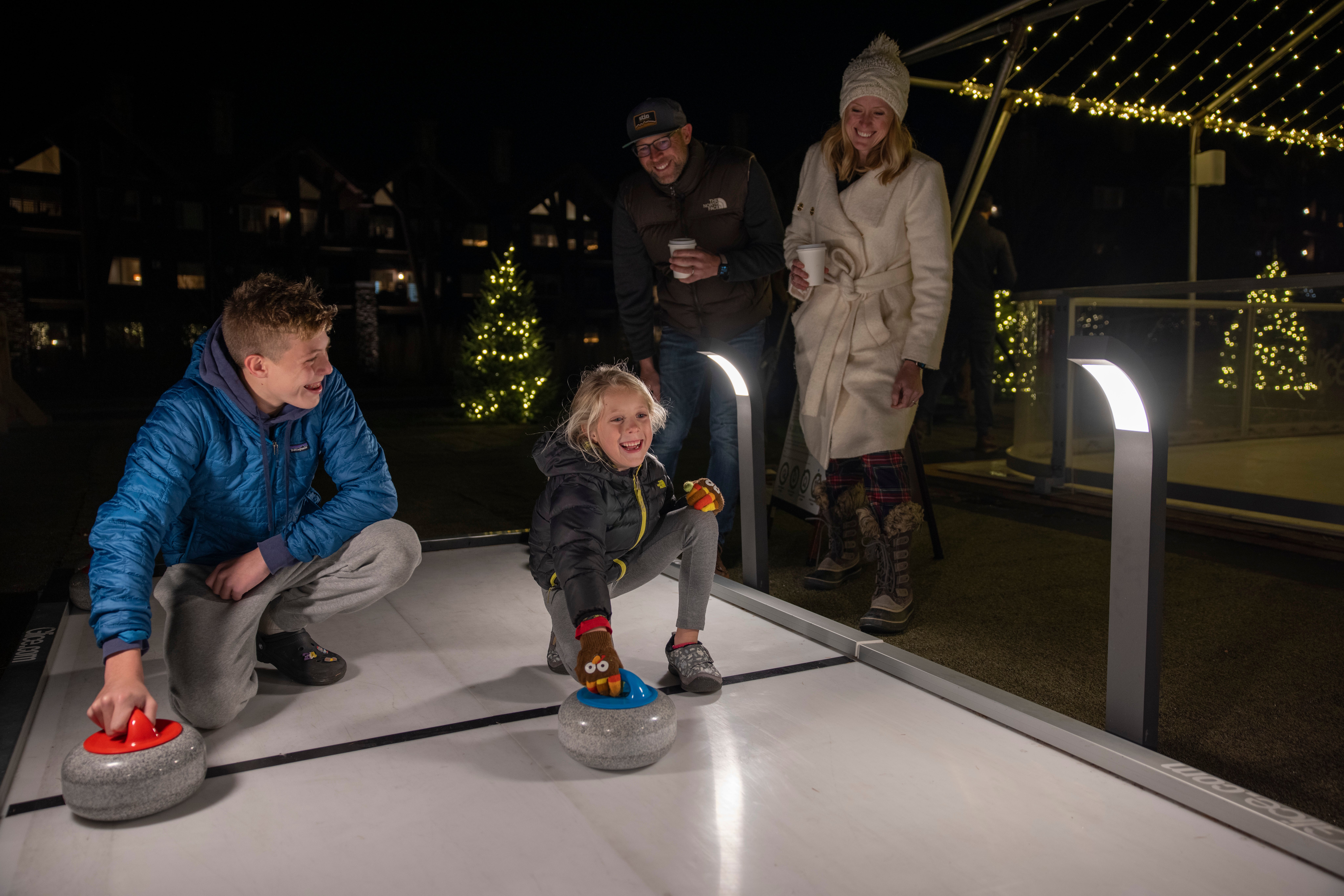 Two children curling. 