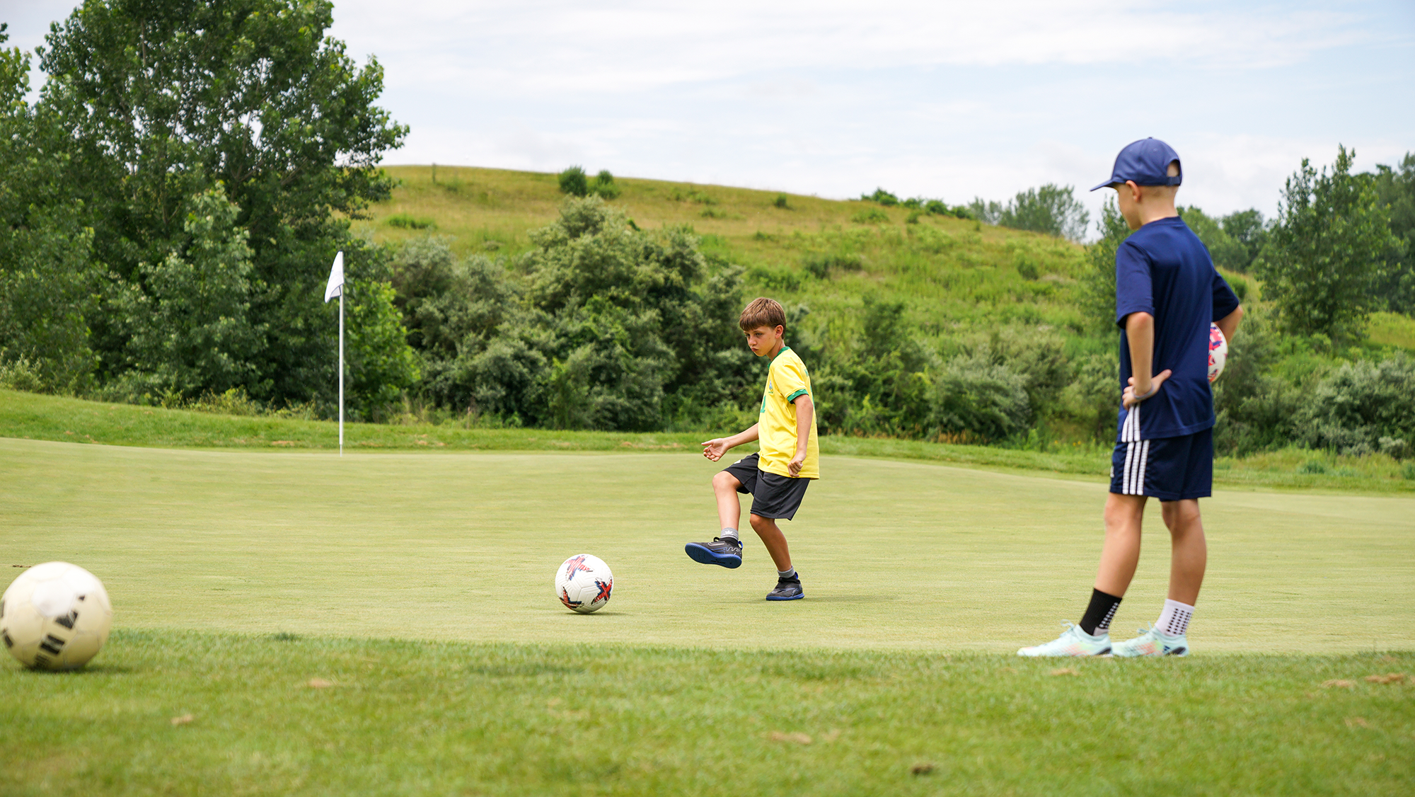 Children playing footgolf. 
