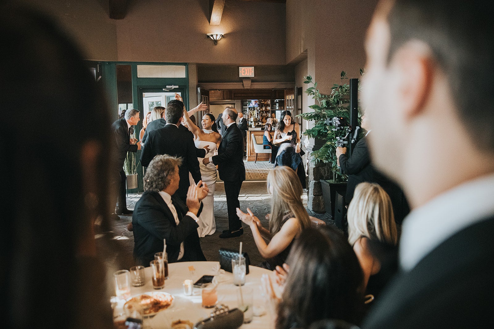 Bride and groom walk into reception at Big Sky Pavillion