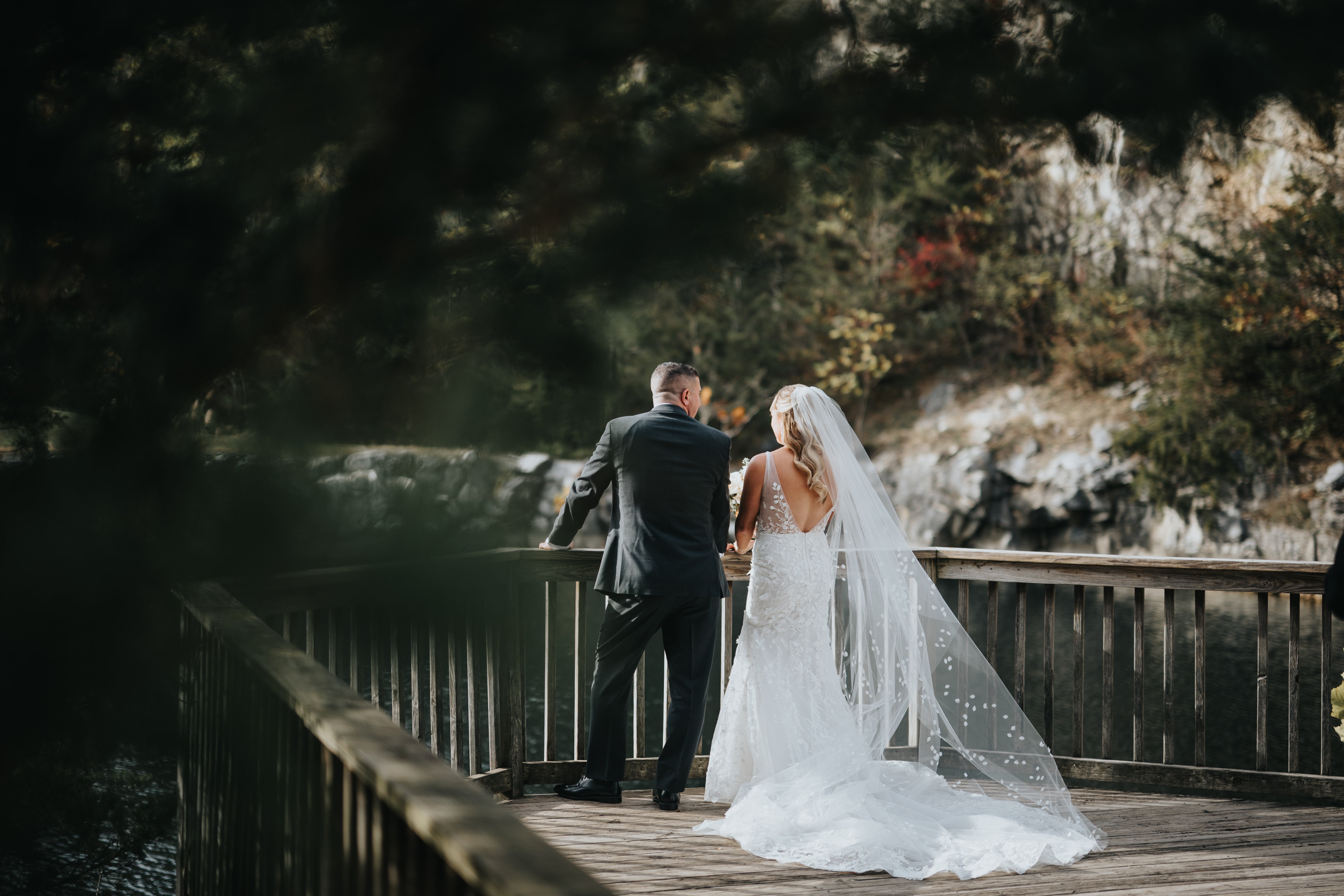 Bride and groom looking out at Quarry at Grand Cascades Lodge