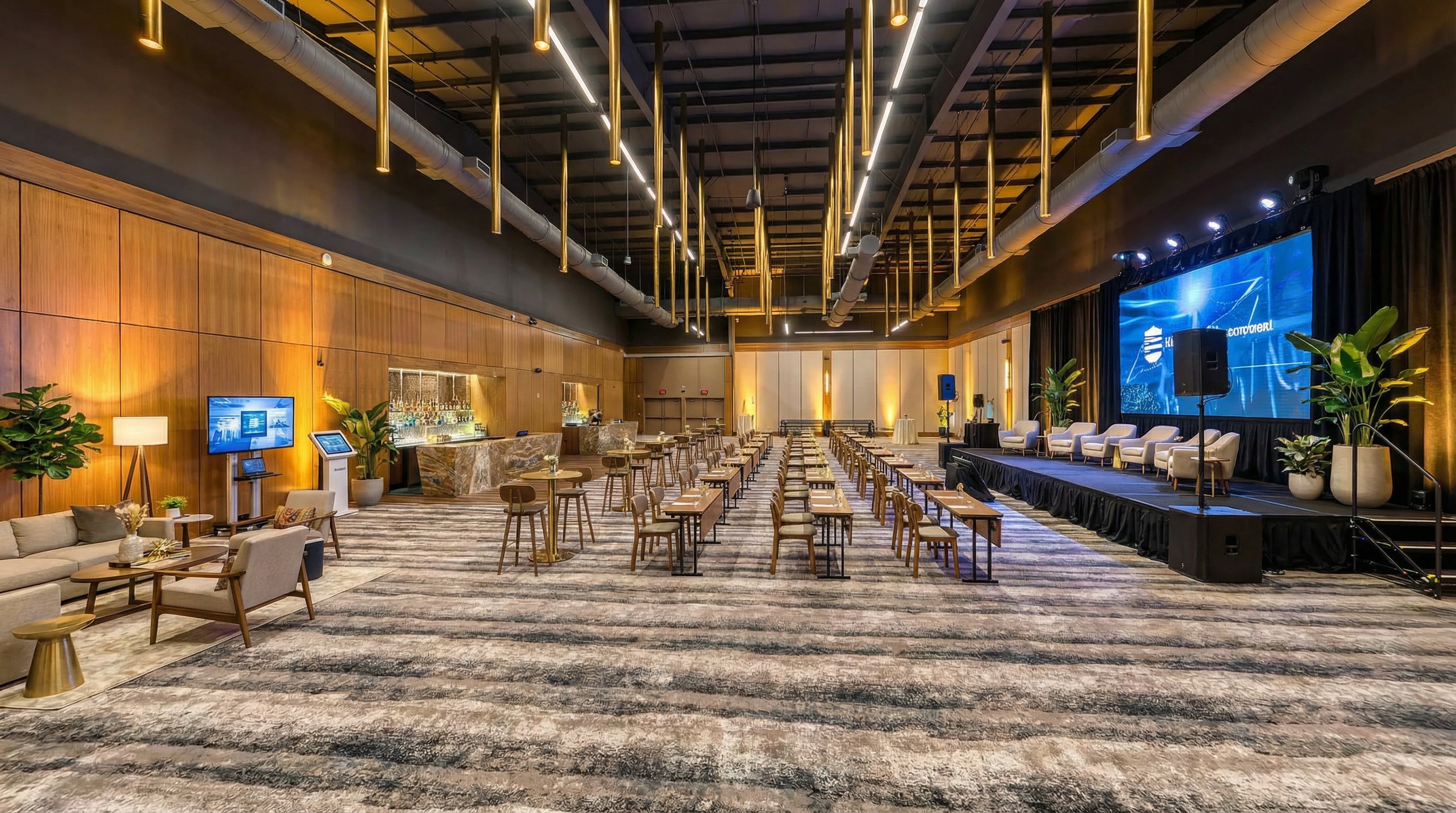 Conference room at Crystal Springs Resort set with rows of chairs, lounge seating and a large presentation screen