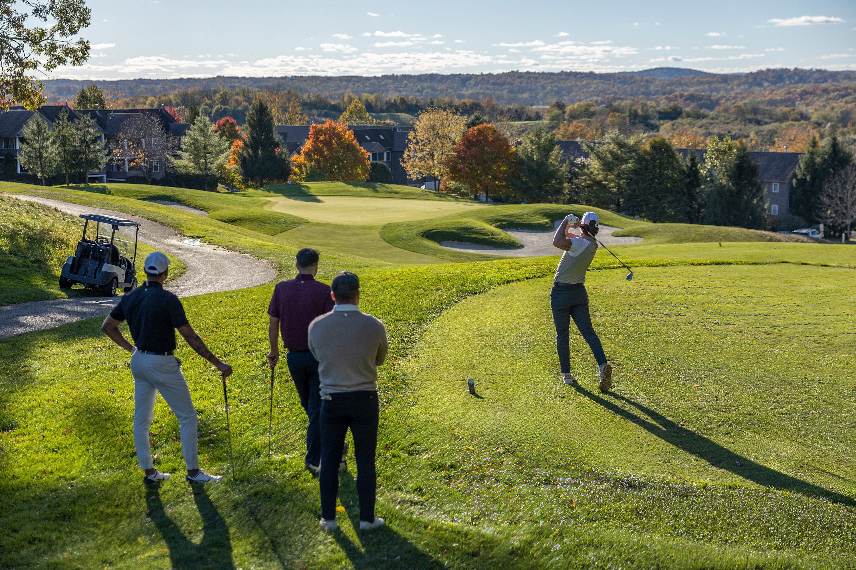 Four golfers on golf course at Crystal Springs Resort.