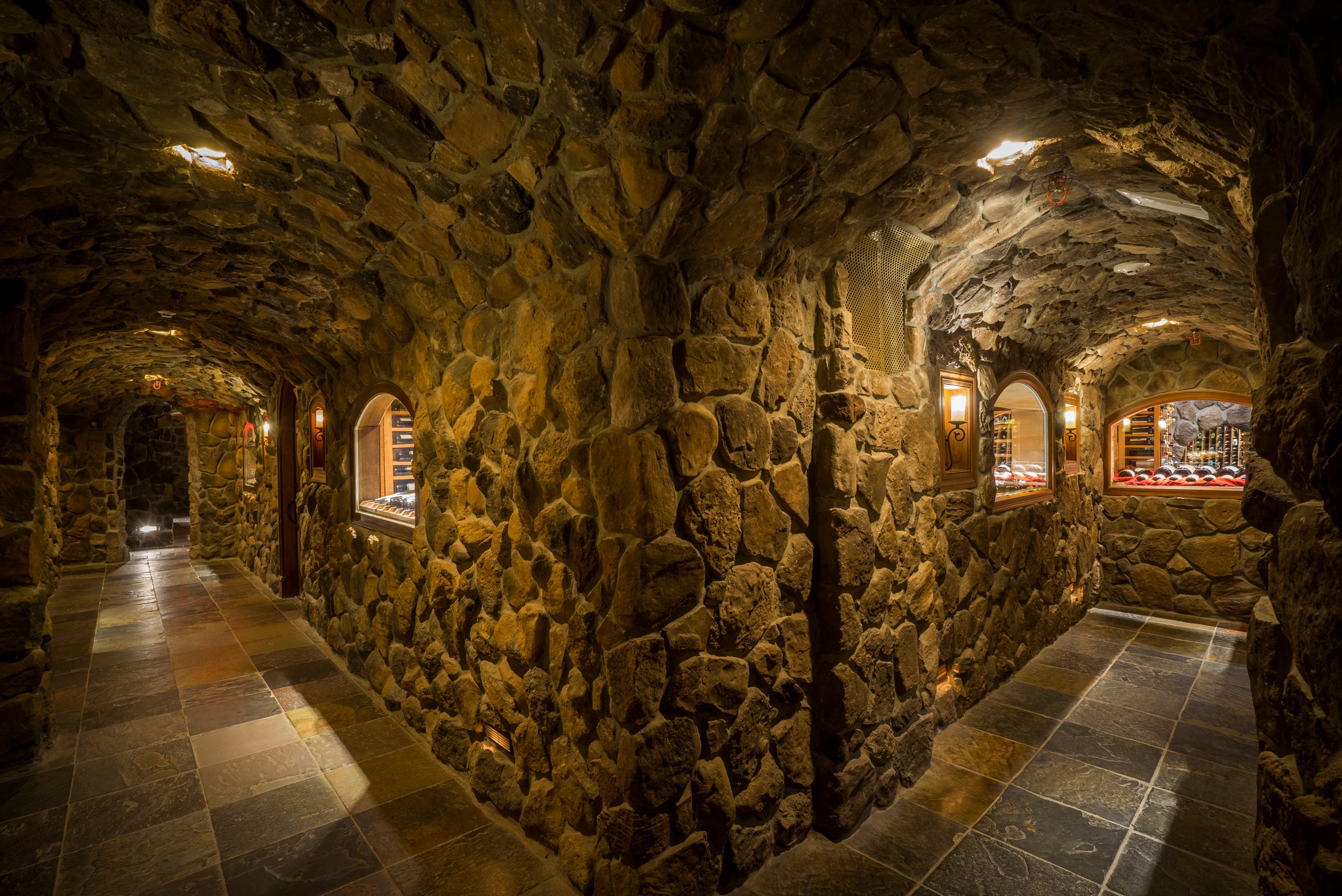 Rustic stone corridor with arched passageways at Crystal Springs Resort