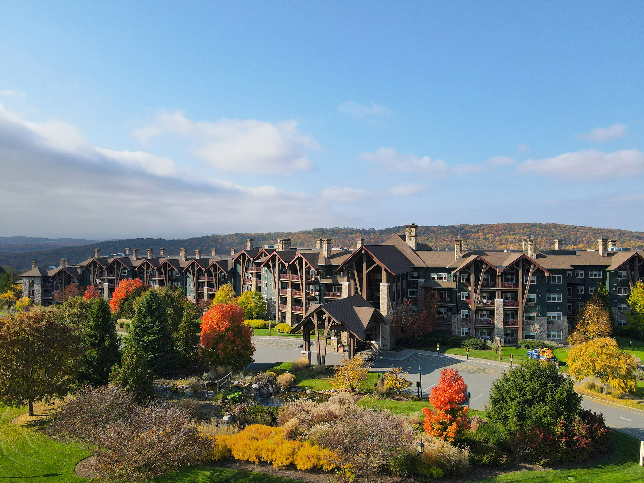 Elevated view of Crystal Springs Resort accommodations surrounded by colorful autumn foliage and mountain scenery in New Jersey.