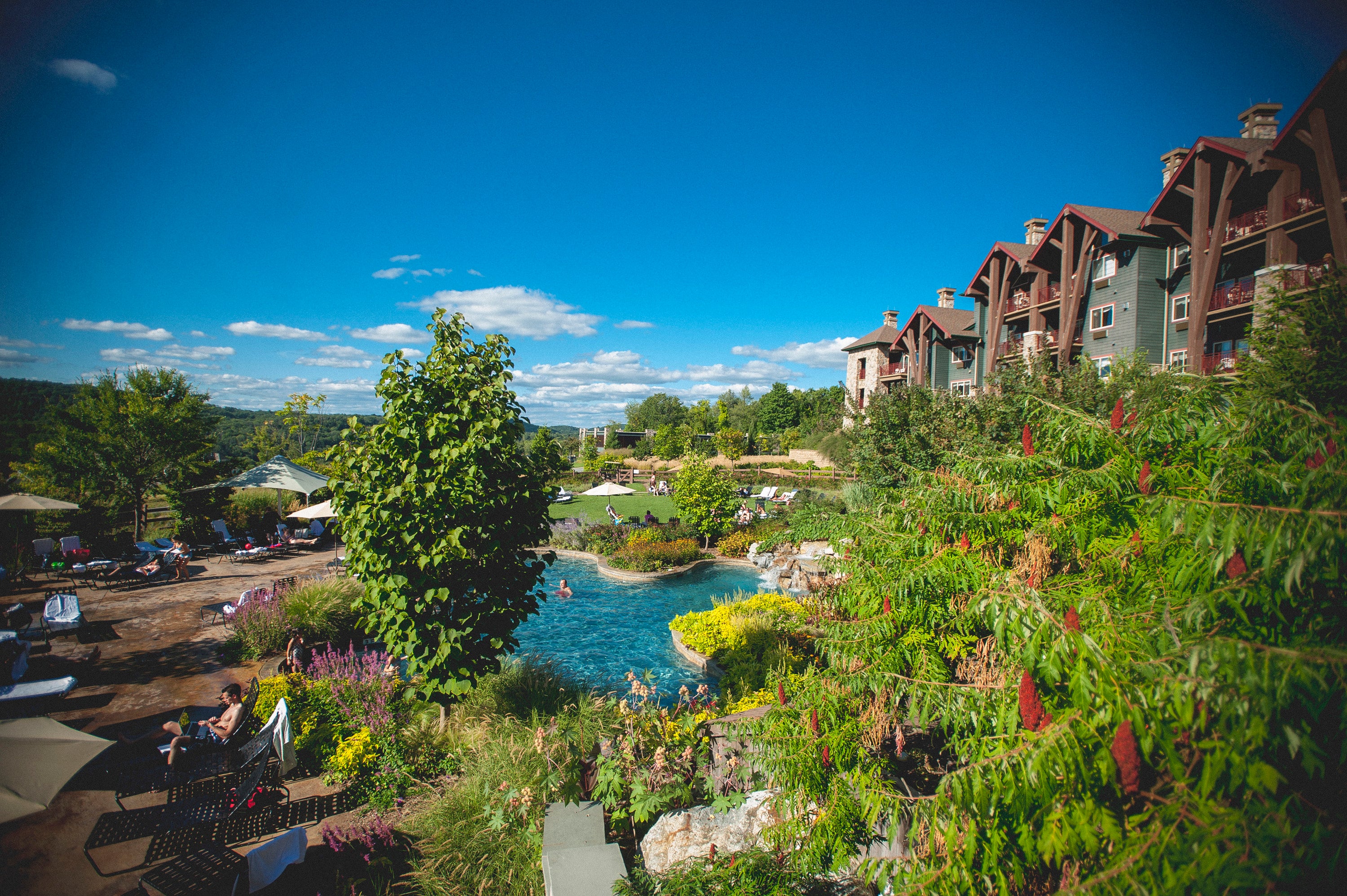 Outdoor Biosphere Pool Complex with Grand Cascades Lodge on right side.