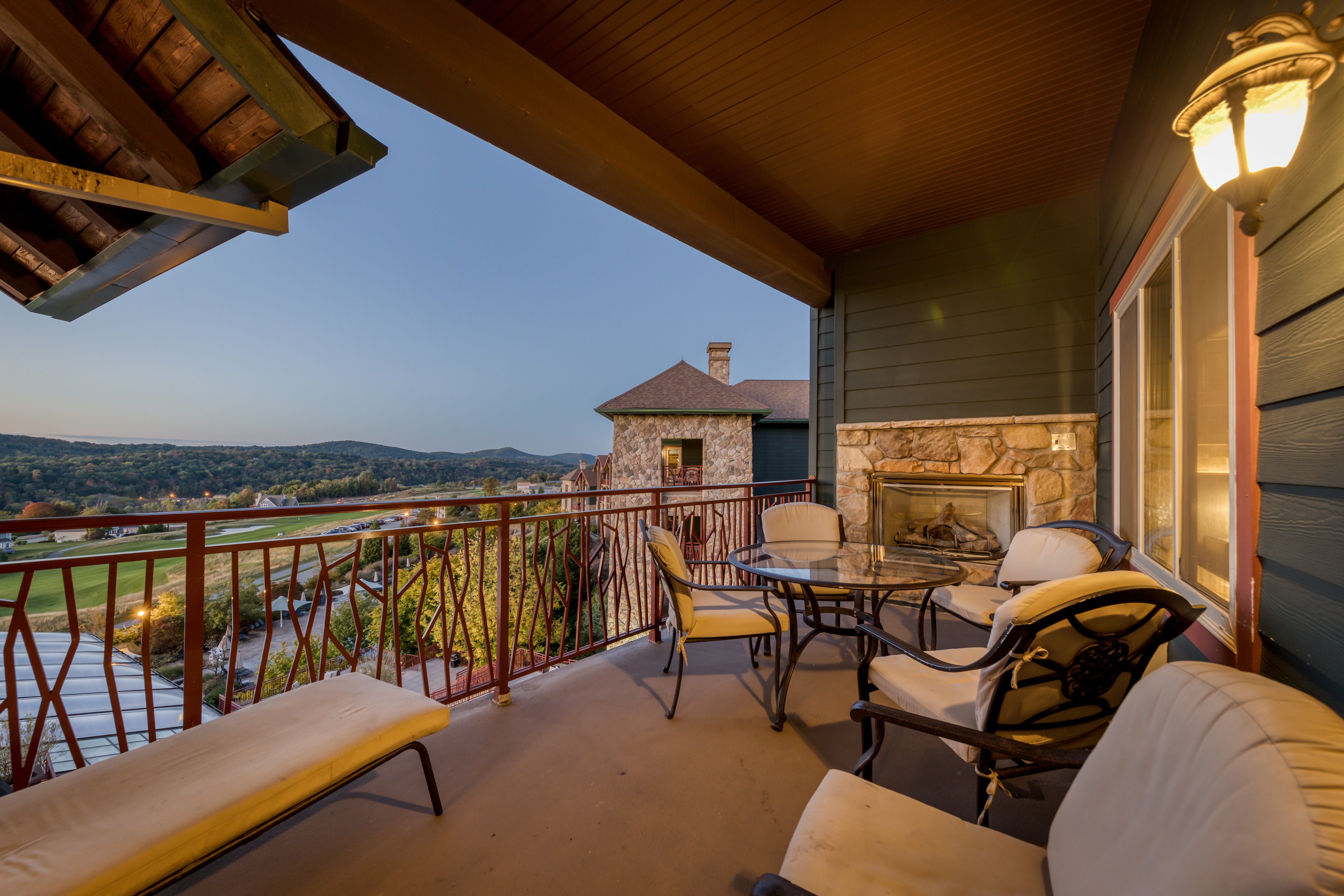 Hotel room balcony overlooking Fire and Water Terrace at Grand Cascades Lodge