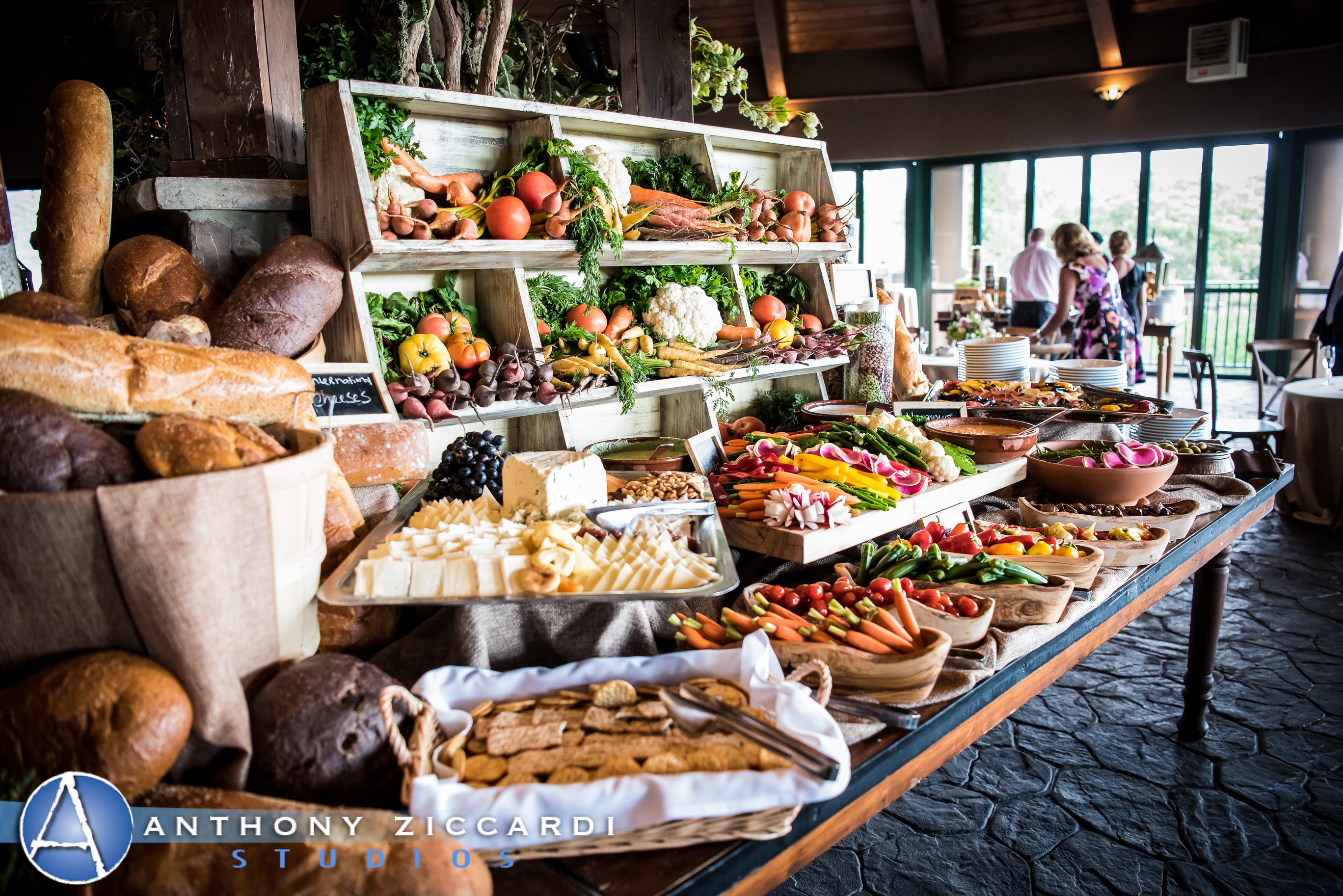 Cocktail hour table food displayCocktail hour table food display of breads, cheeses and more
