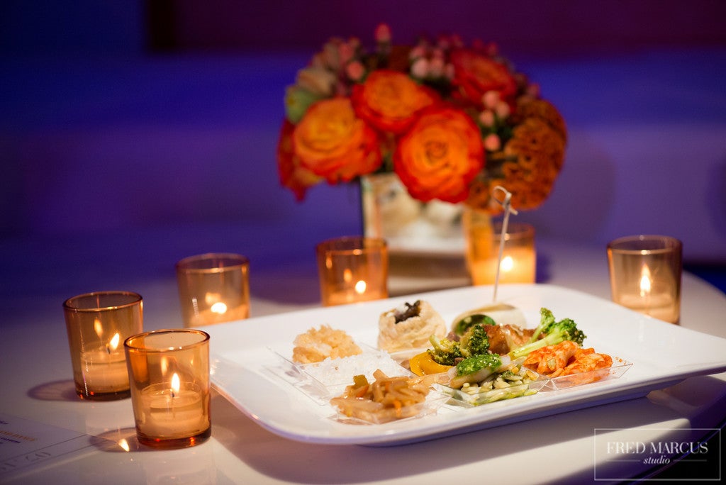 Small hors d'oeuvres plate surrounded by candles