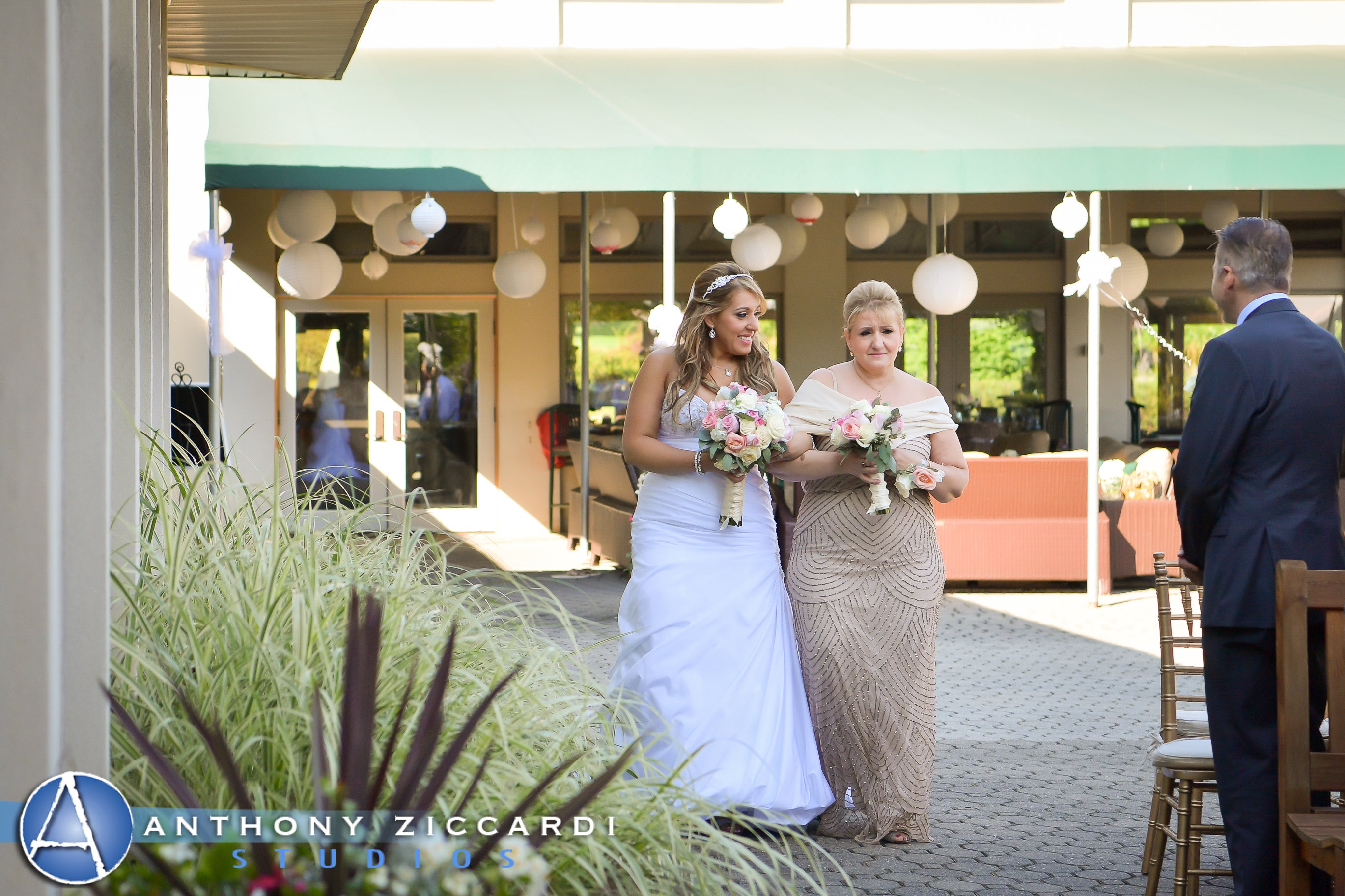 Bride walking down aisle with mother