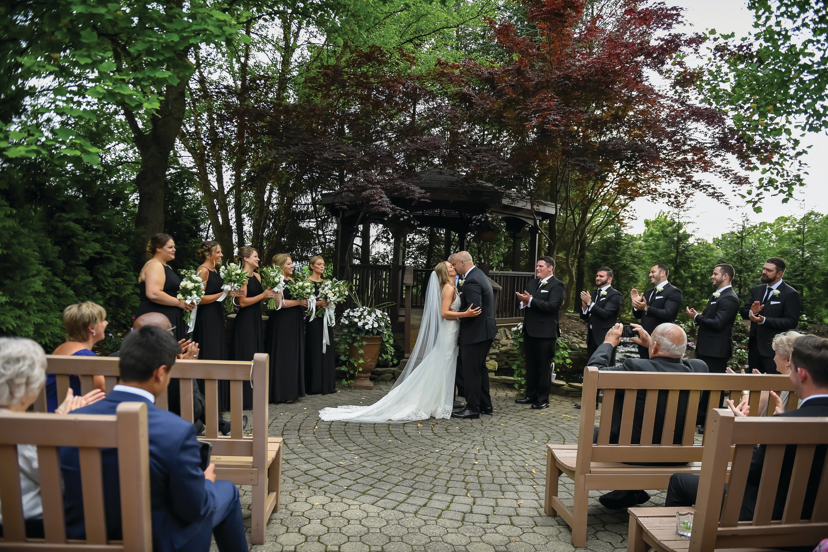 Bride and groom kissing during wedding ceremony