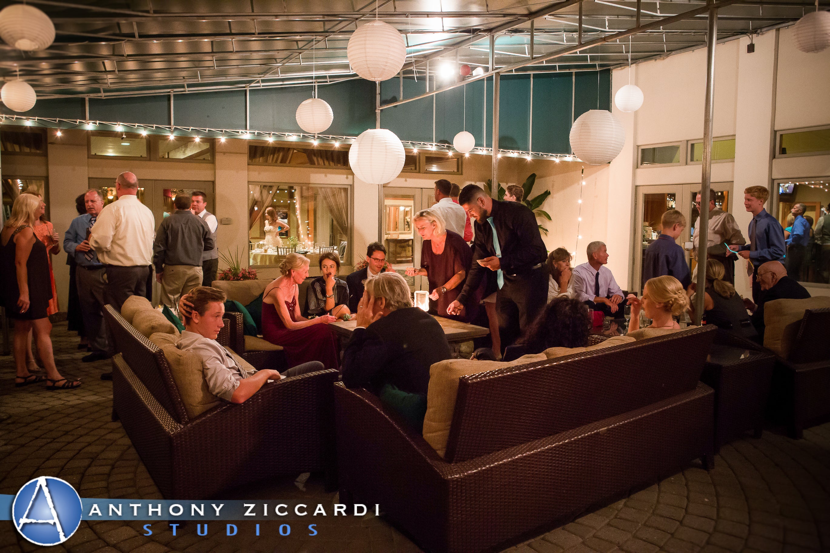 Wedding guests around fire pit at Black Bear outdoor seating area