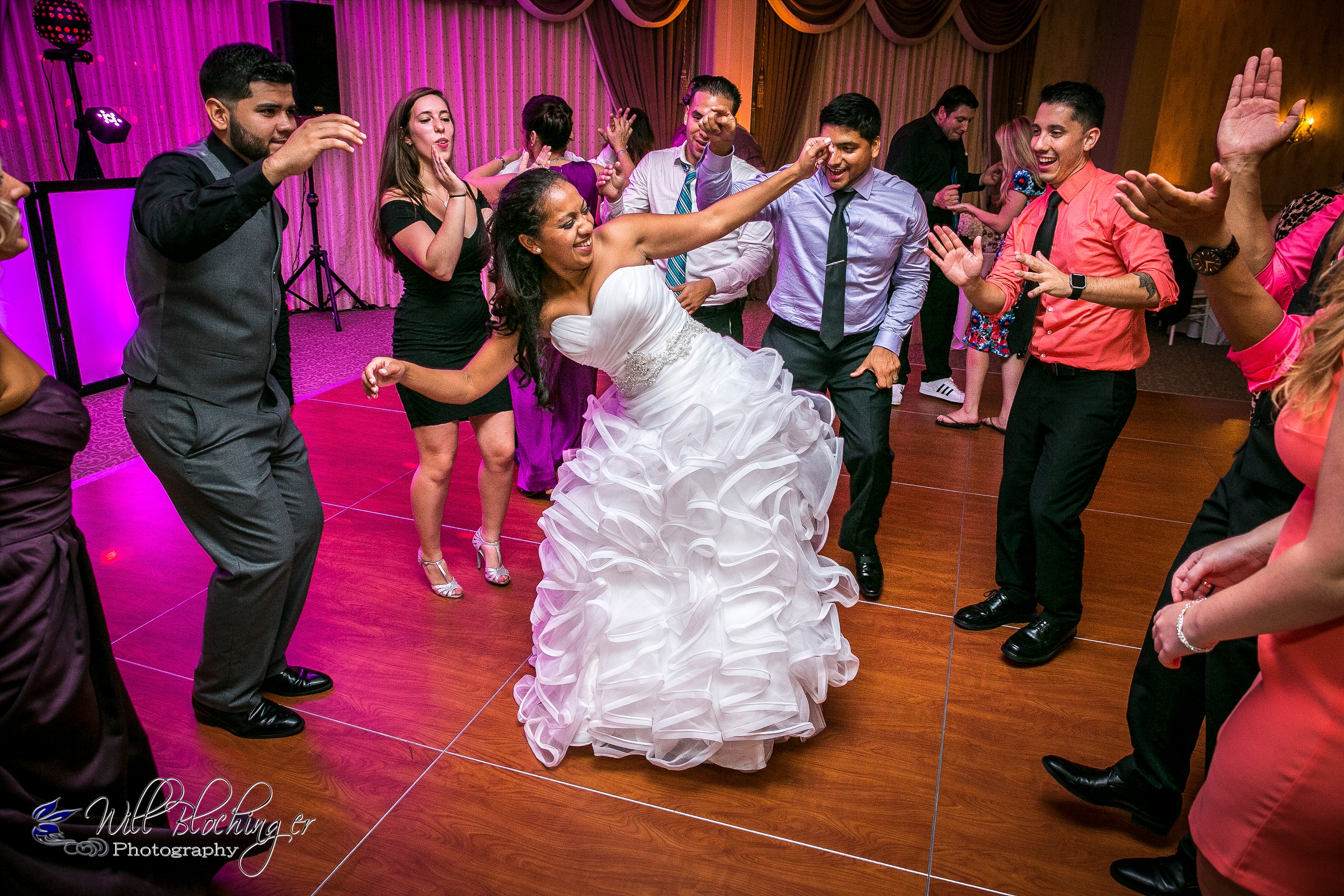 Bride dancing with wedding guests