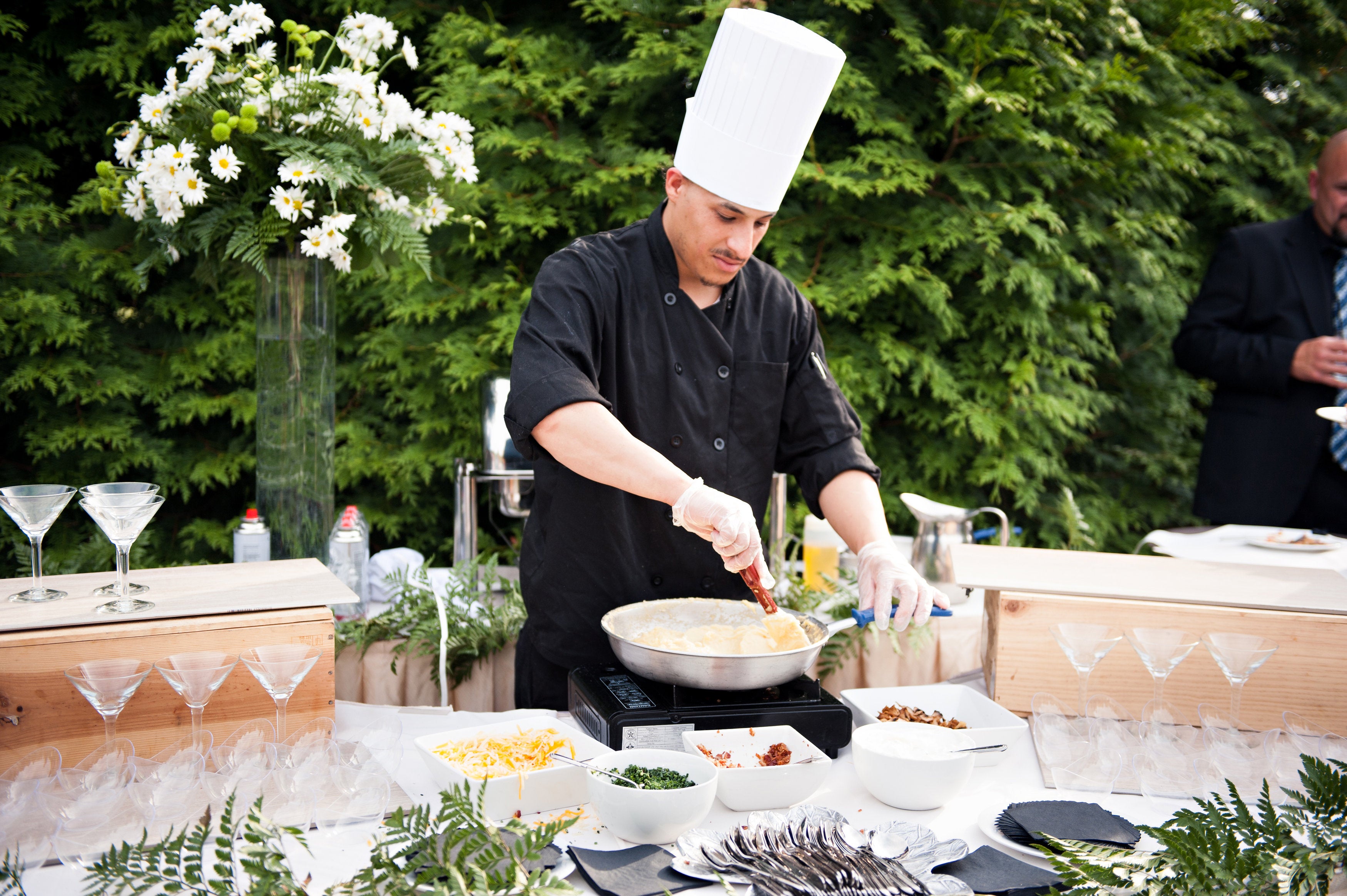 Chef cooking fresh food at cocktail hour