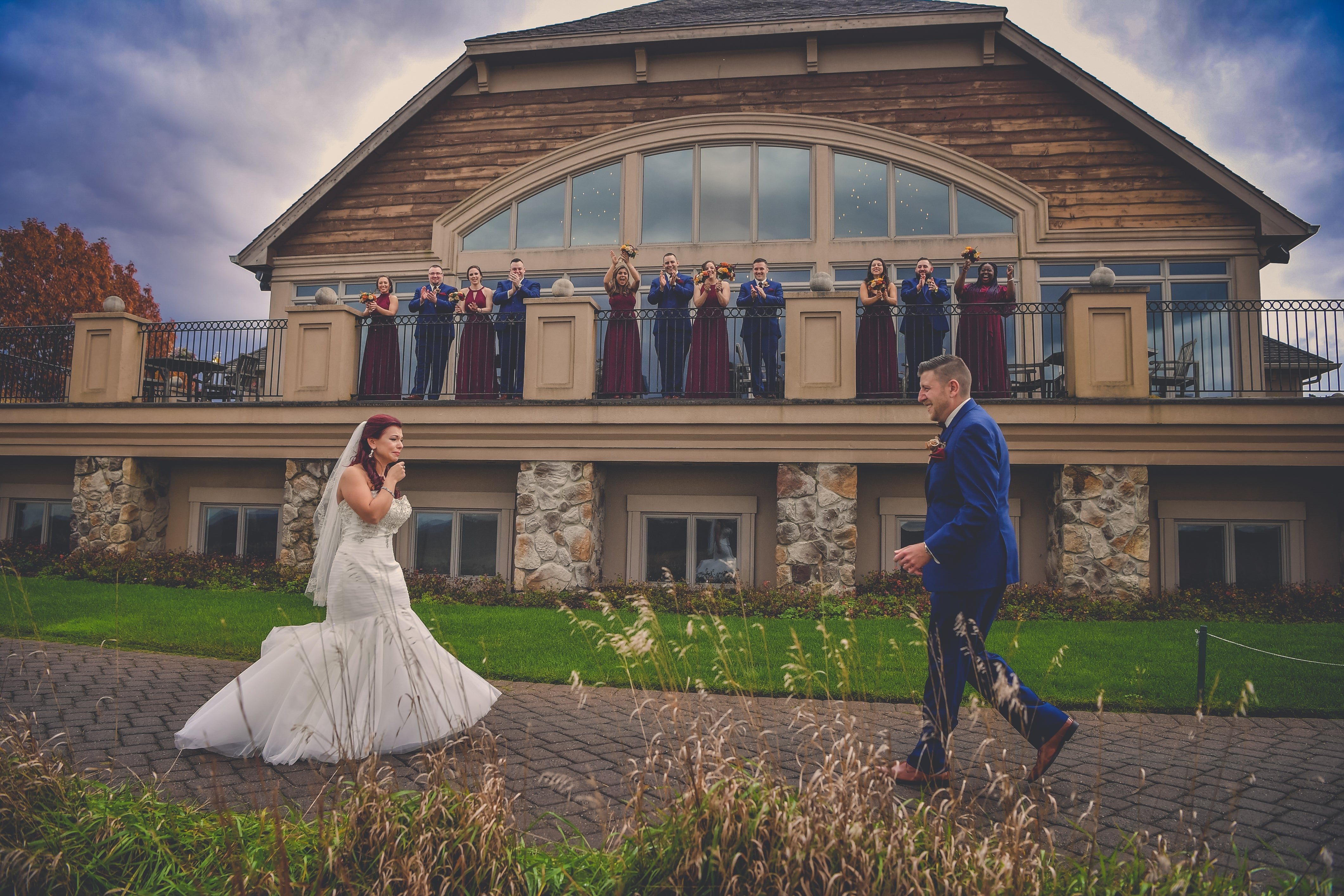 Wedding couple first reveal with wedding party watching from the Ballyowen balcony
