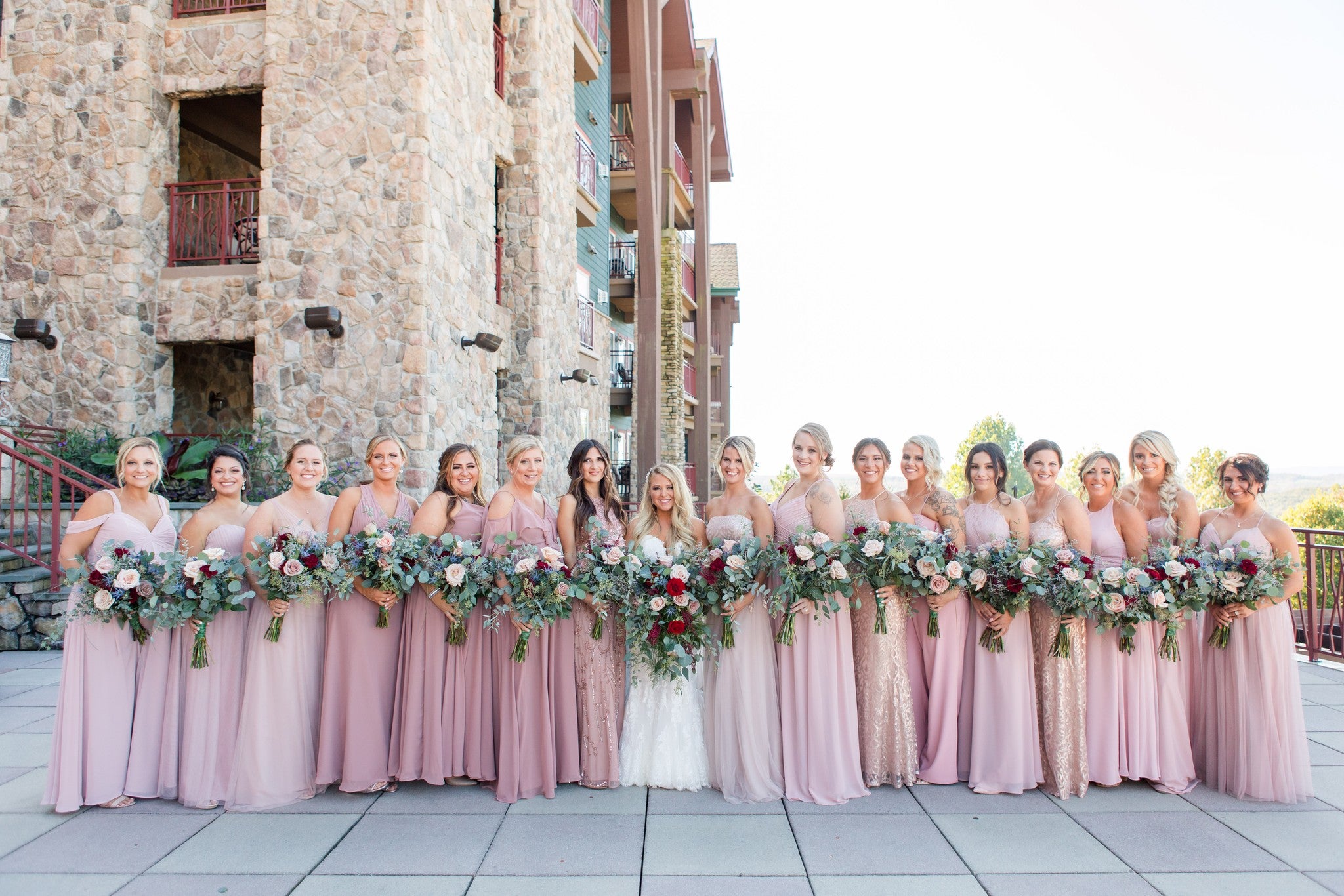 Bridesmaids in light pink dresses ready for wedding ceremony