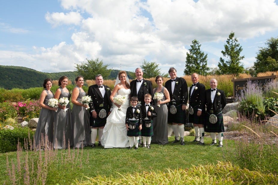 Bride and Groom with wedding party outside Crystal Springs Country Club