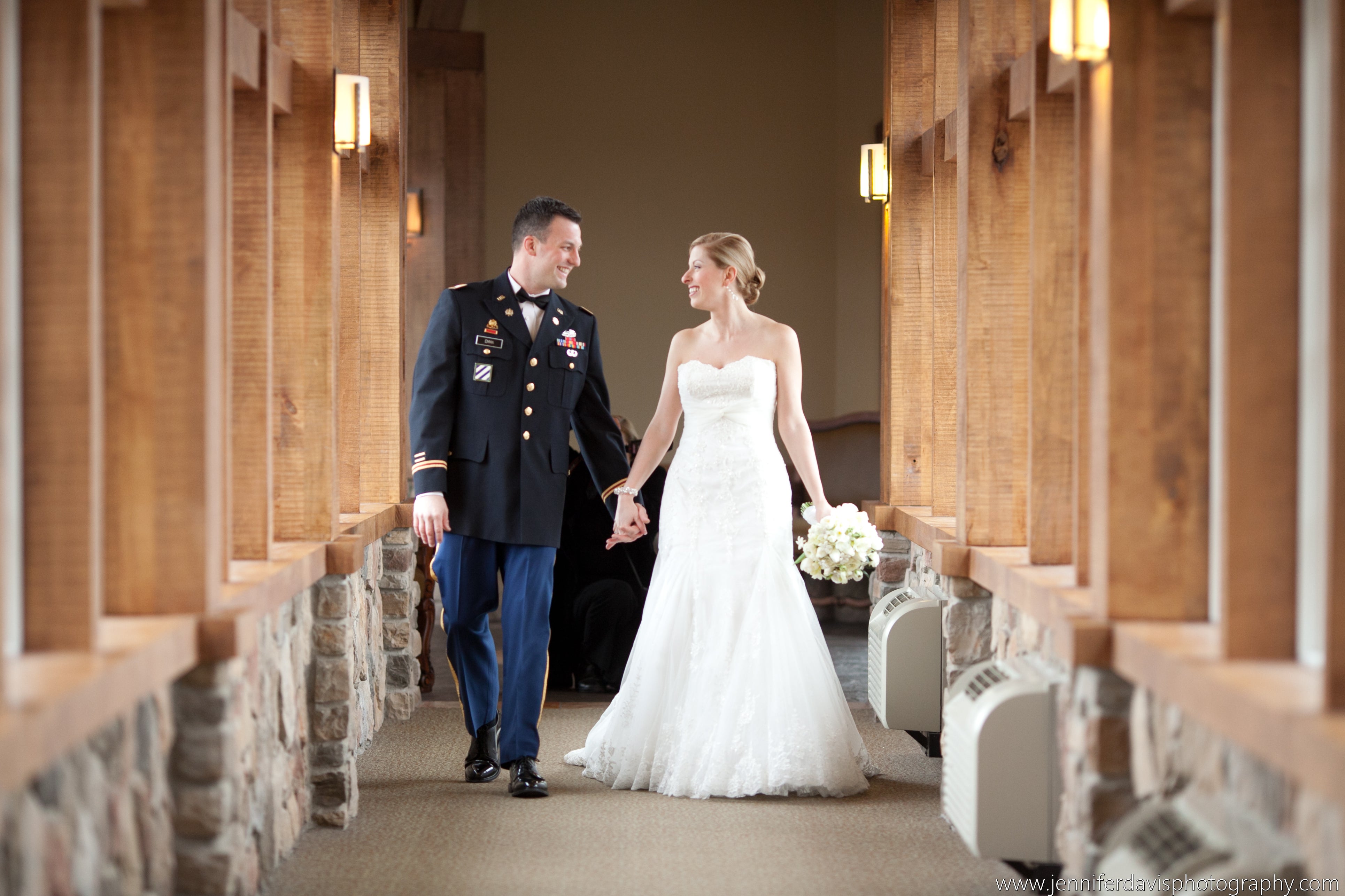 Bride and groom walking the halls of Grand Cascades Lodge