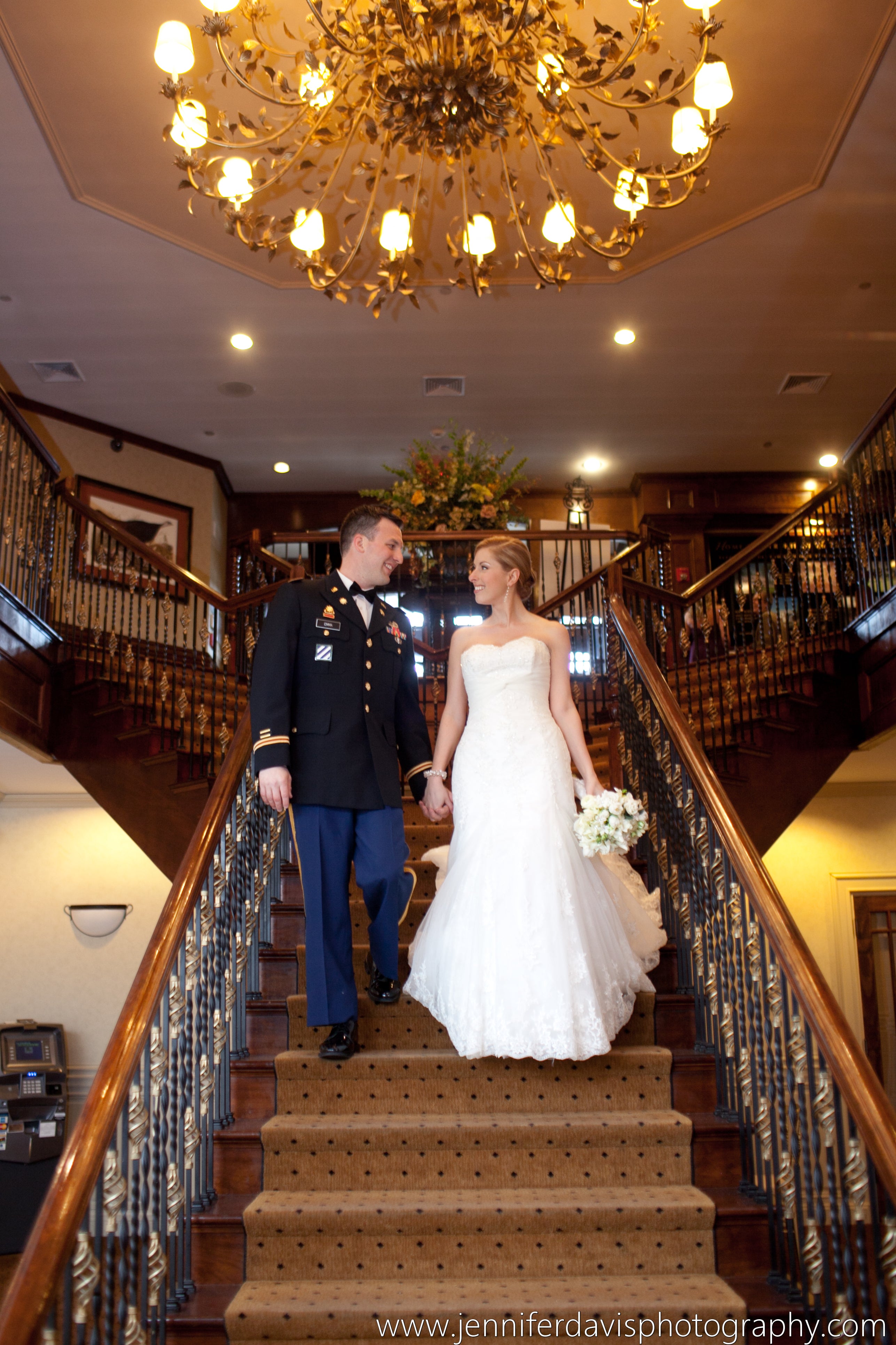 Wedding couple walking down stairs at Crystal Springs Clubhouse