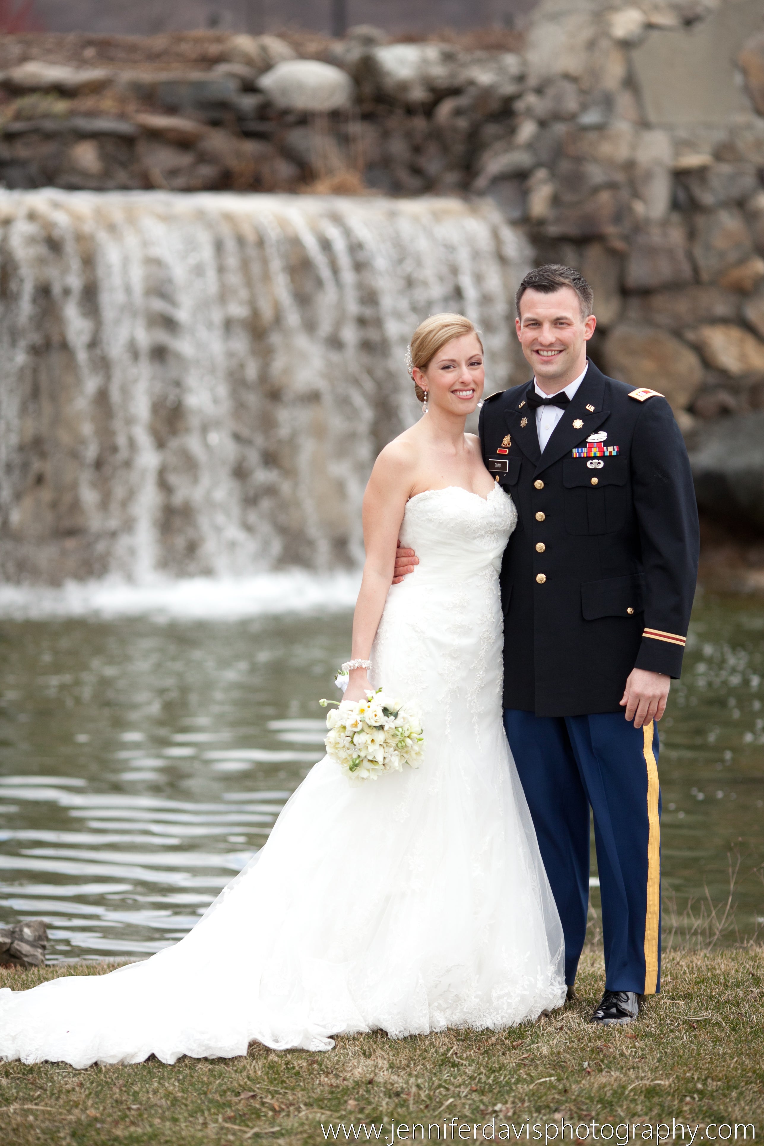 Bride and groom in front of waterfall